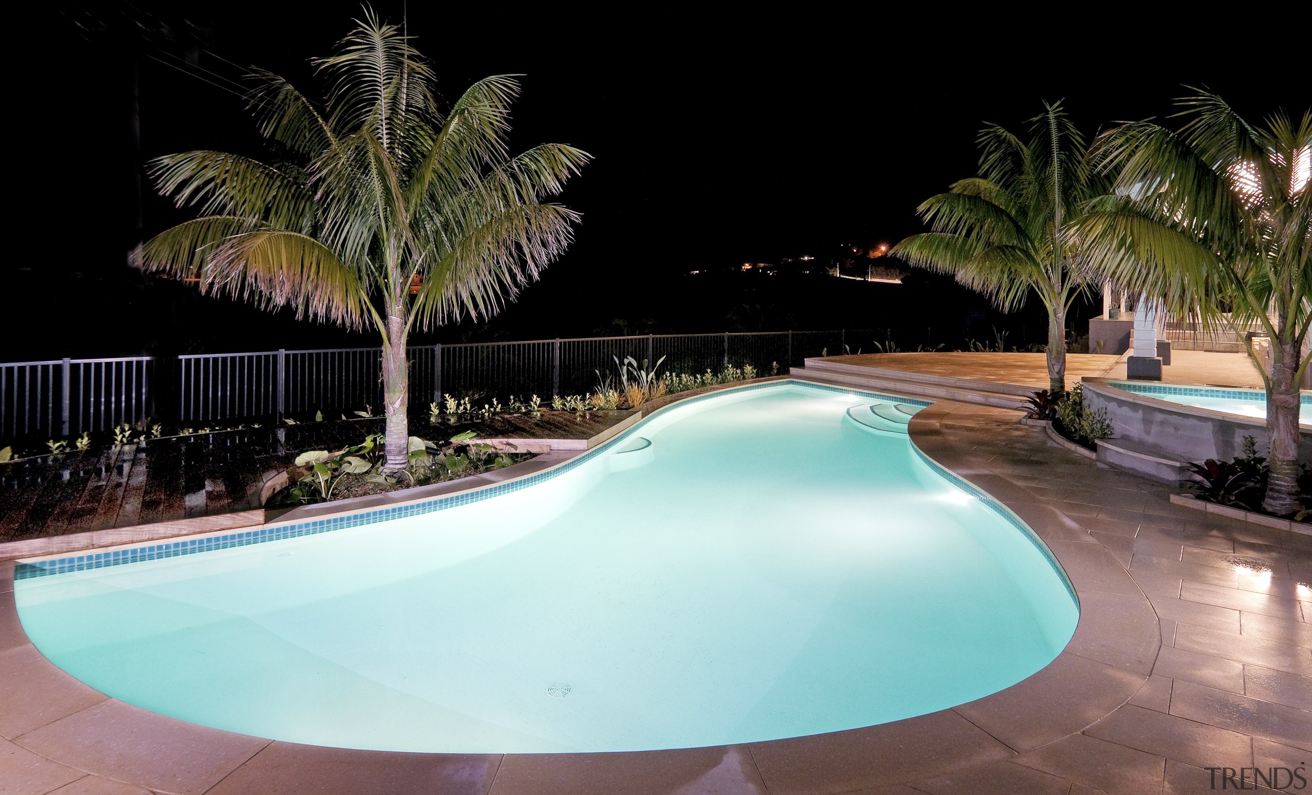 View of a resort-styled pool which was built arecales, estate, leisure, lighting, palm tree, property, real estate, resort, swimming pool, water, black