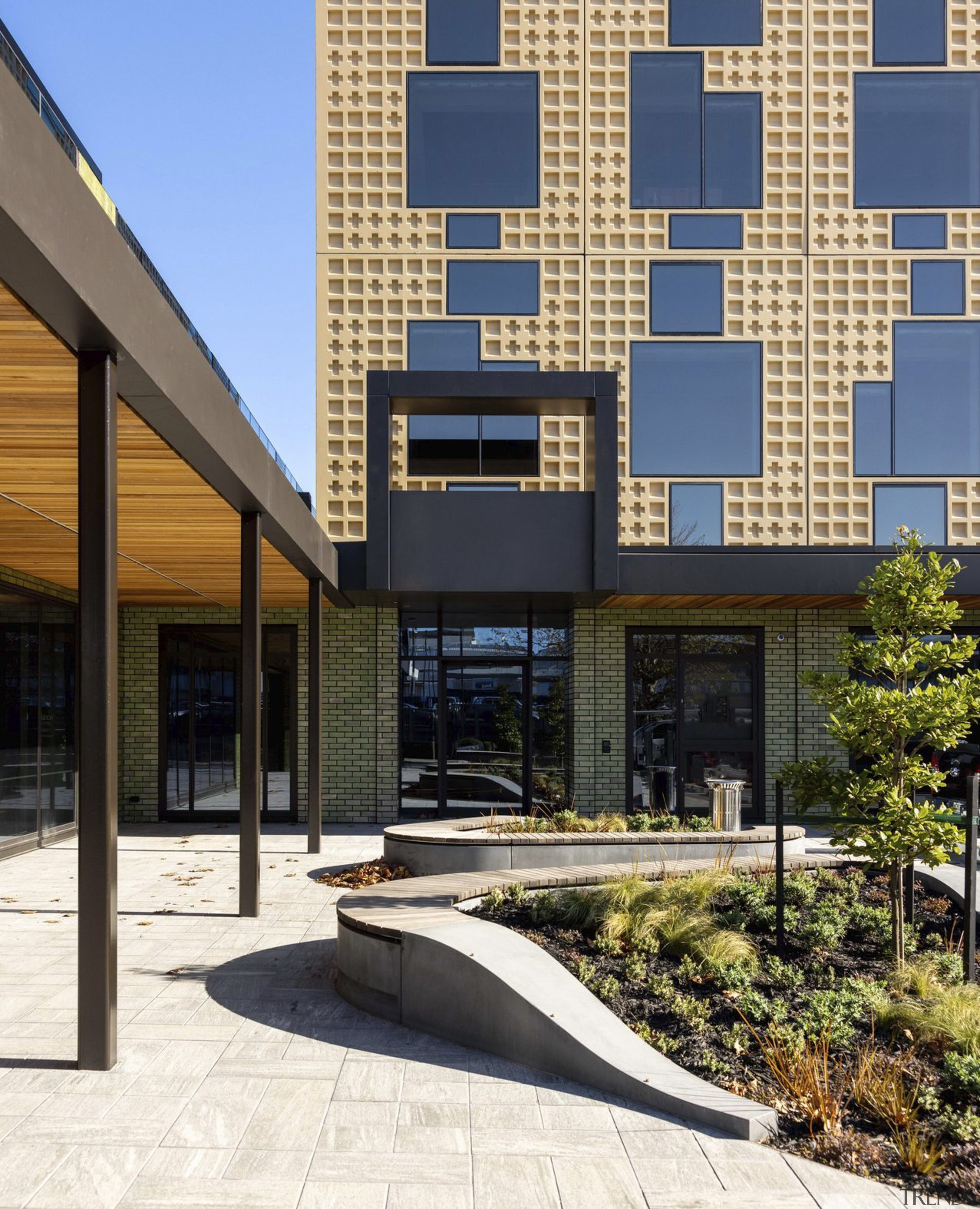 The arrival court comprises curved amenity garden beds 