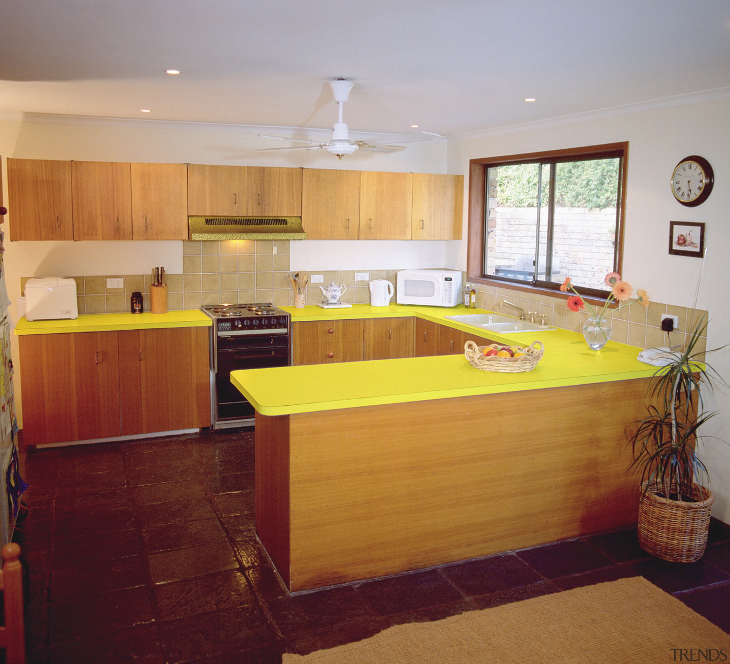 Kitchen with timber cabinetry and yellow benchtop, before cabinetry, ceiling, countertop, floor, flooring, interior design, kitchen, real estate, room, table, wood, gray