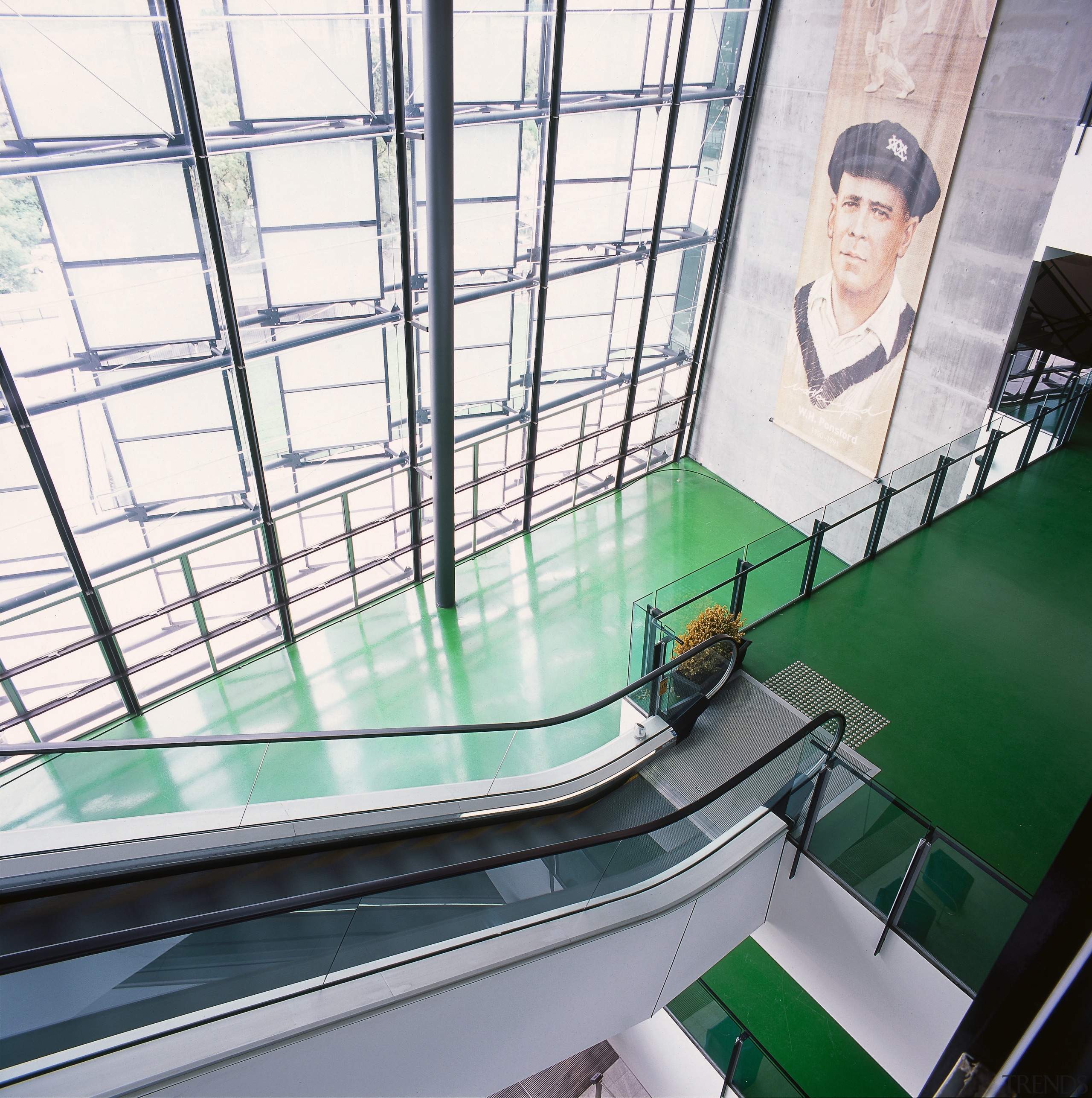 Green epoxy flooring in stadium with escalator and architecture, building, daylighting, escalator, glass, structure, white