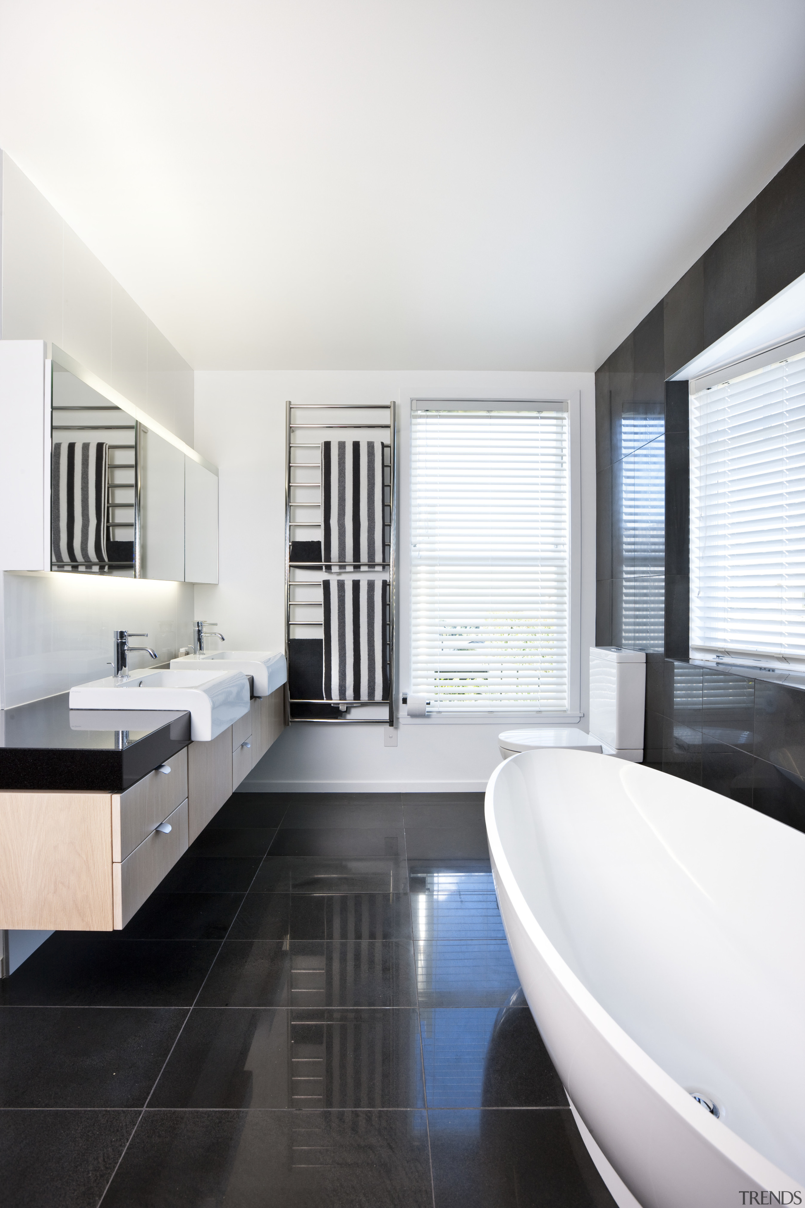 View of the bathroom which features a freestanding architecture, bathroom, daylighting, floor, flooring, interior design, room, sink, white