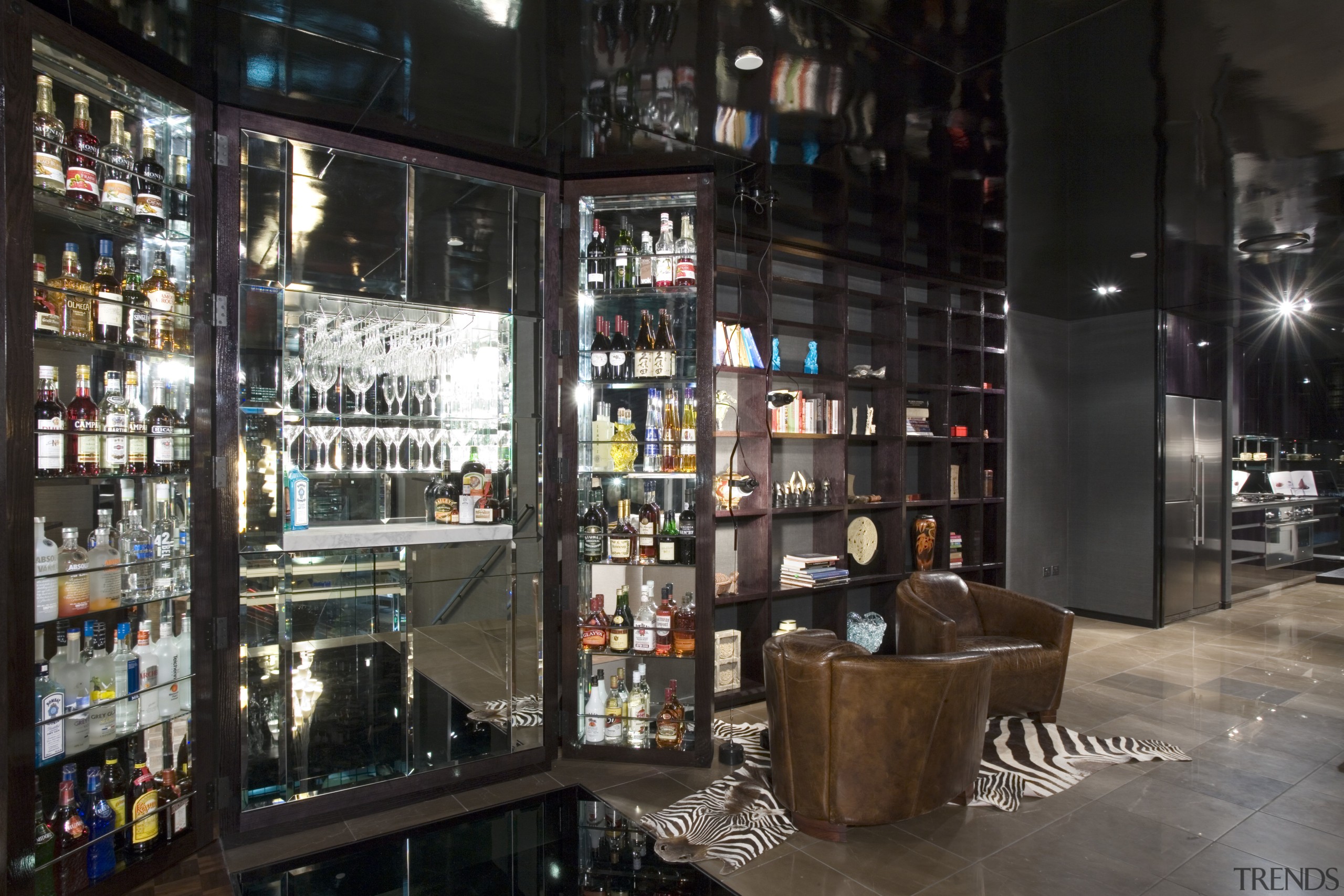 A view of the master bedroom featuring bed, bar, liquor store, black