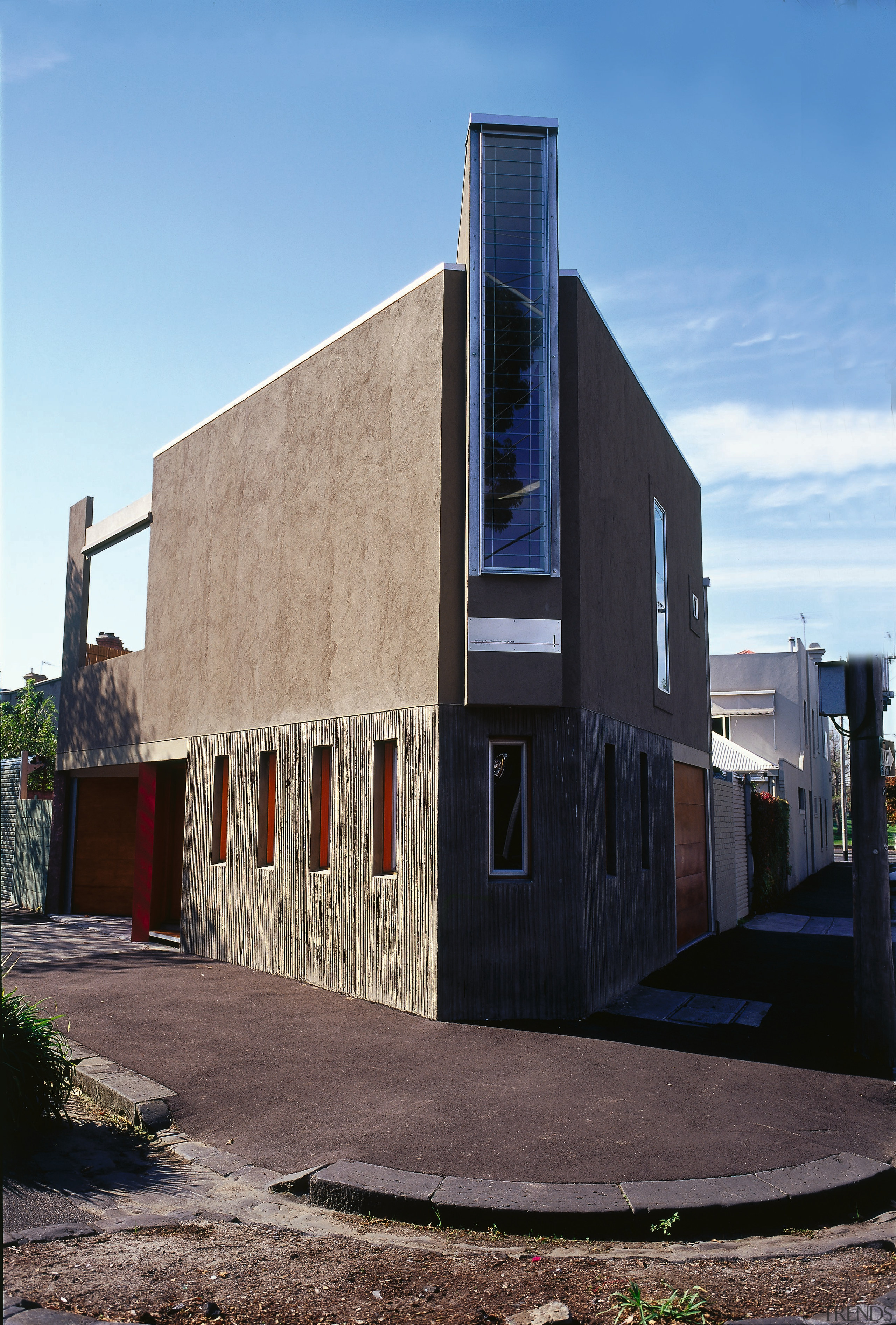 An exterior corner of a house - An architecture, building, facade, house, neighbourhood, real estate, residential area, sky, black, teal