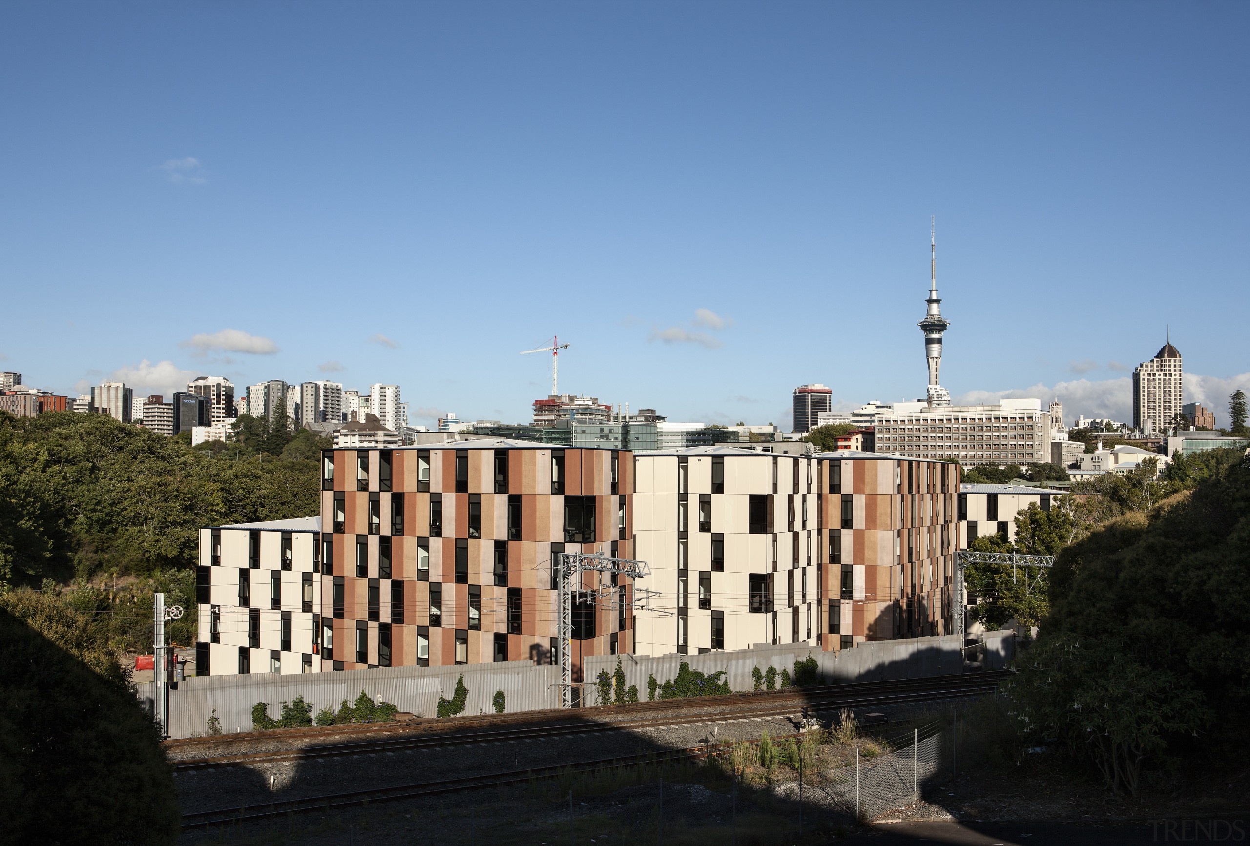 Carlaw Park Student Village in Auckland accommodates students architecture, building, city, cityscape, daytime, downtown, landmark, metropolis, metropolitan area, neighbourhood, residential area, roof, sky, skyline, skyscraper, tower block, tree, urban area, teal, black