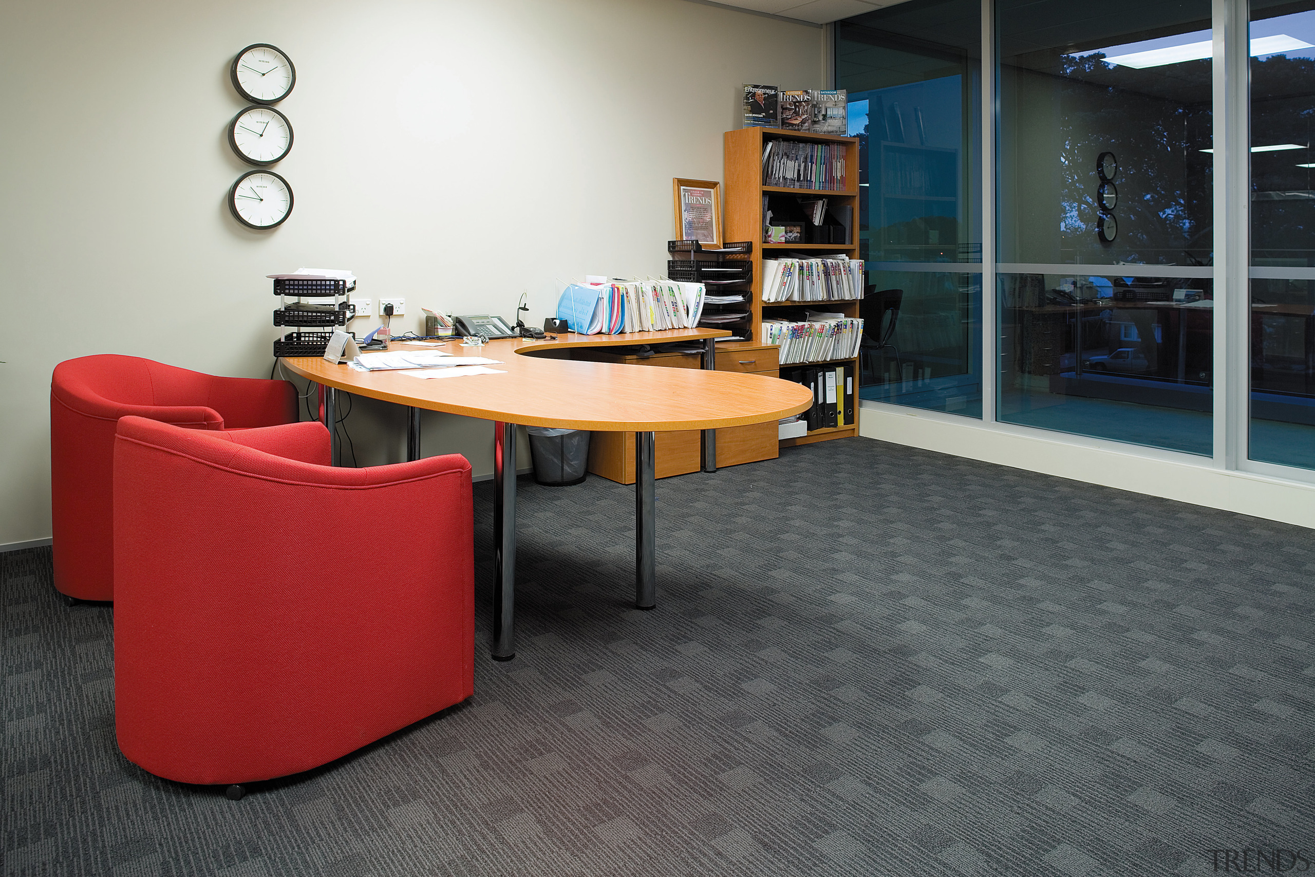 A view of the office furnishings. - A chair, desk, floor, flooring, furniture, institution, interior design, office, product design, table, black