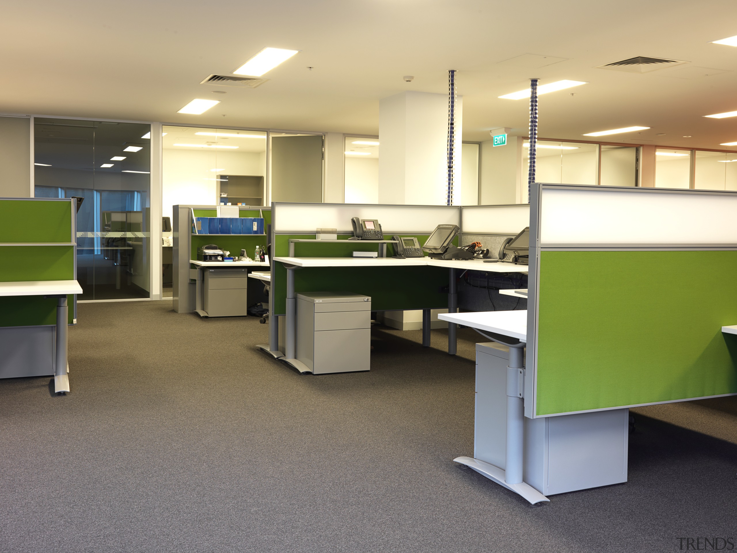 View of an office area within the MCC desk, floor, flooring, furniture, interior design, office, product, orange