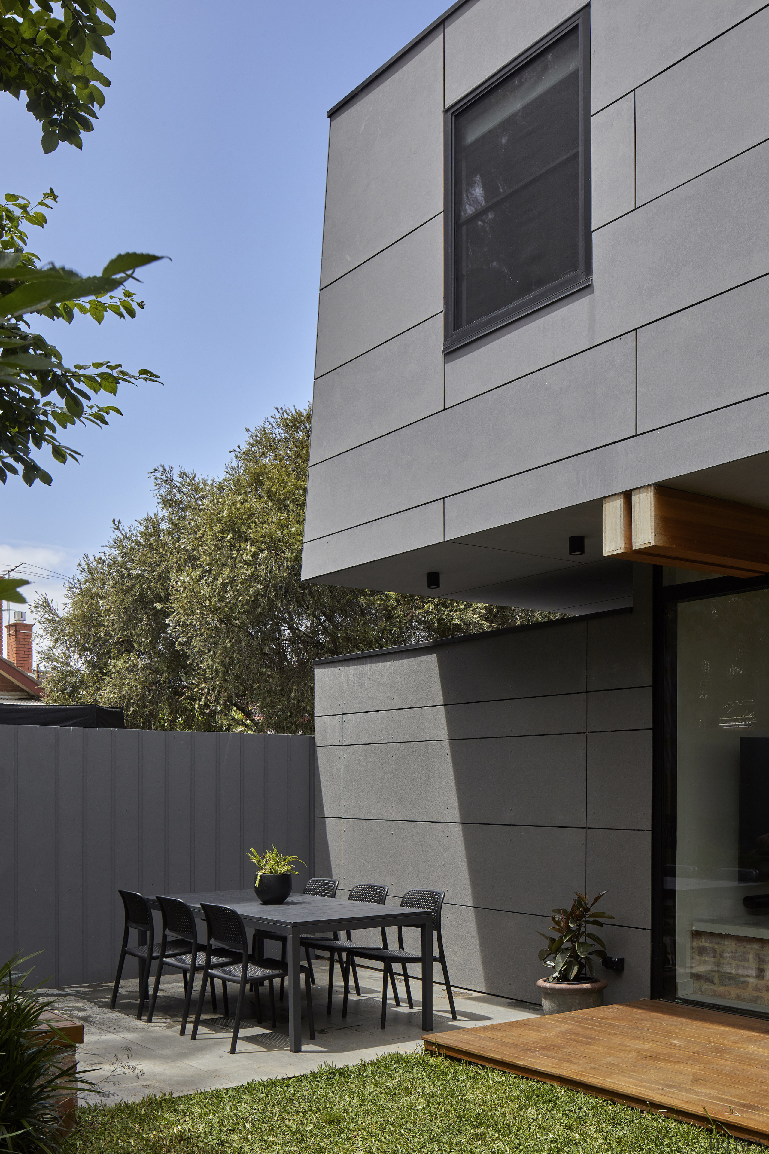 Al fresco dining setting matches the new cladding. 