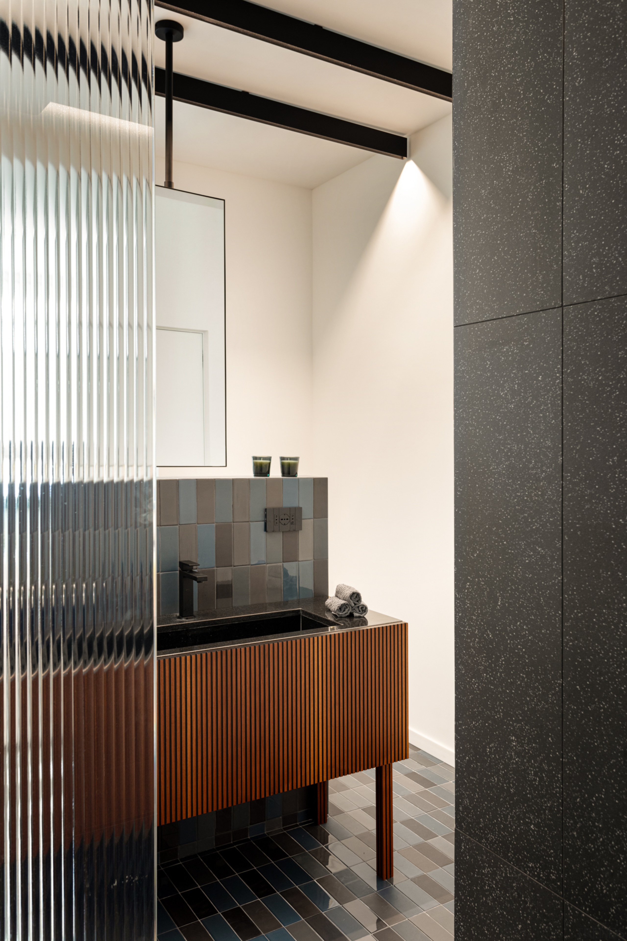 A reeded glass partition in the master ensuite 