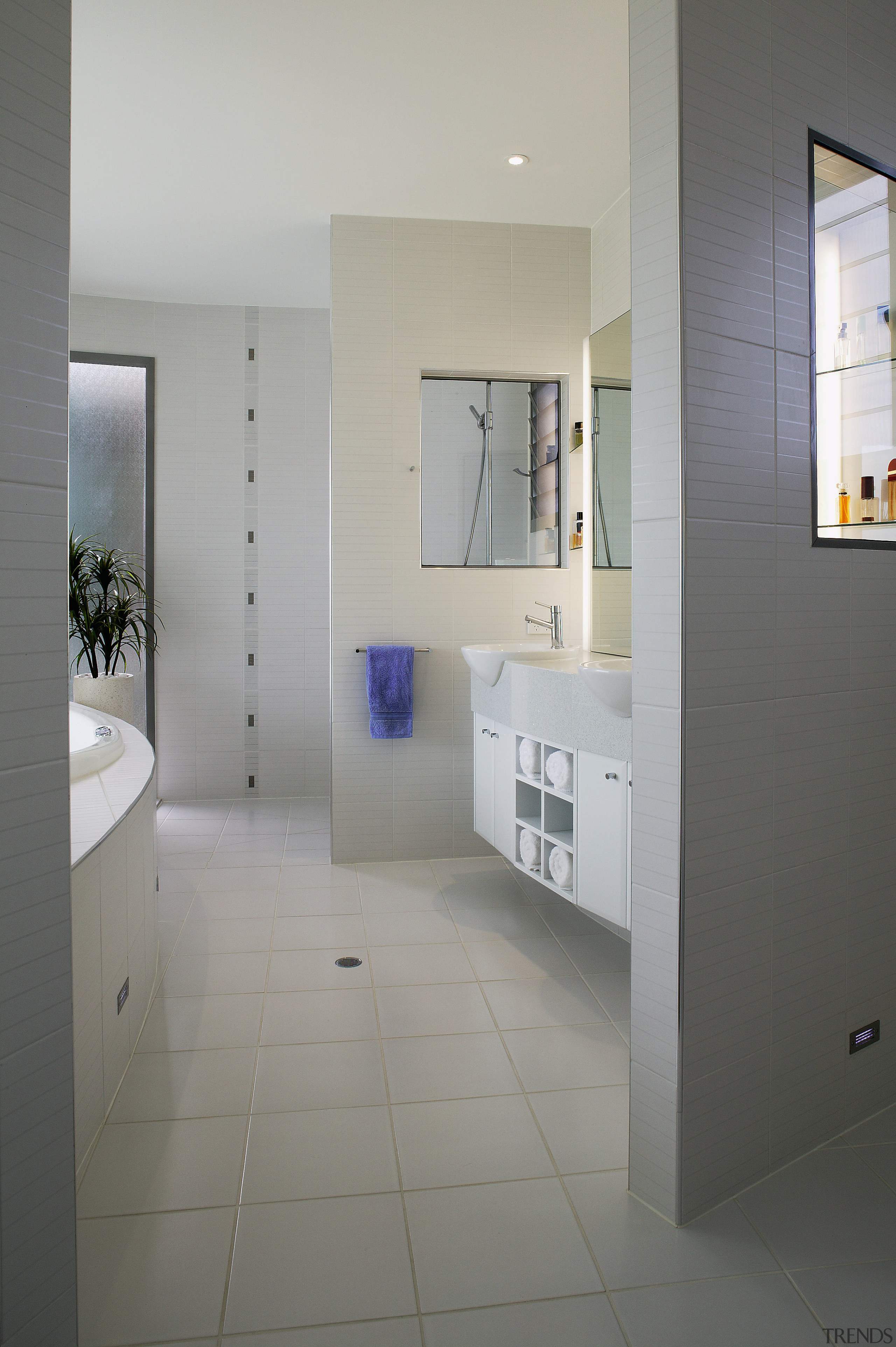 view of the bathroom featuring white tiled flooring, architecture, bathroom, daylighting, floor, flooring, home, house, interior design, real estate, room, tile, gray