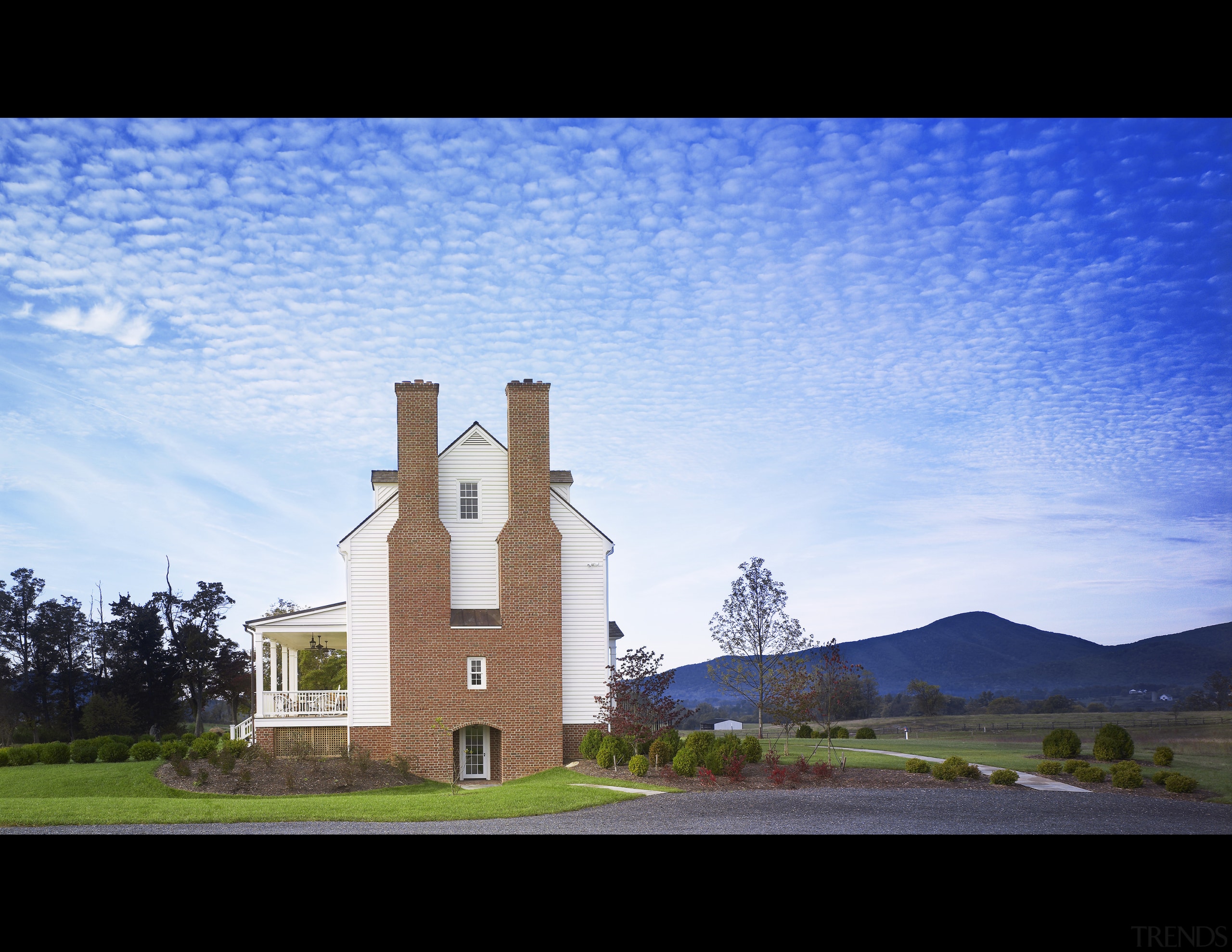 This home was built by Tom Glass of architecture, building, cloud, daytime, estate, field, grass, highland, home, house, meteorological phenomenon, morning, phenomenon, real estate, residential area, rural area, sky, sunlight, tower, tree, teal, black