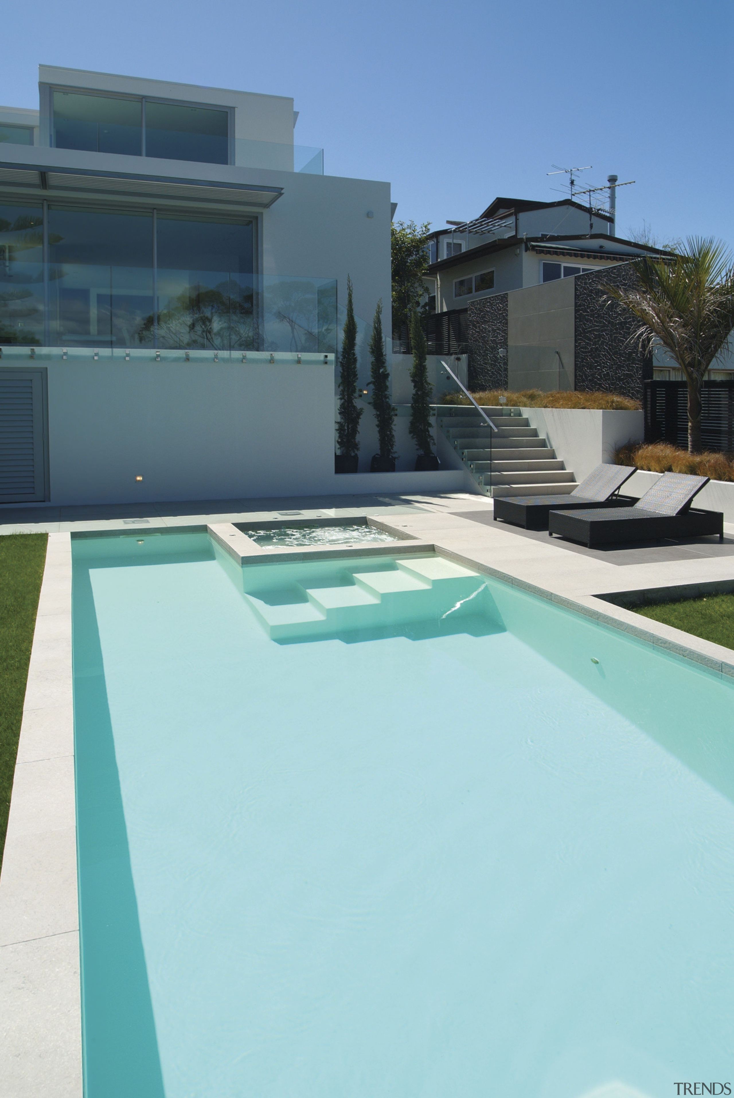 The simple,clean lines of this pool echo the architecture, estate, house, leisure, property, real estate, sky, swimming pool, water, teal