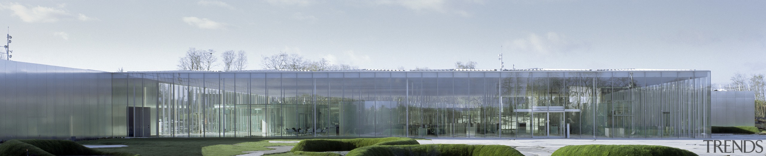 The Louvre satellite gallery has a transparent facade. architecture, building, corporate headquarters, facade, headquarters, house, real estate, roof, sky, gray, white