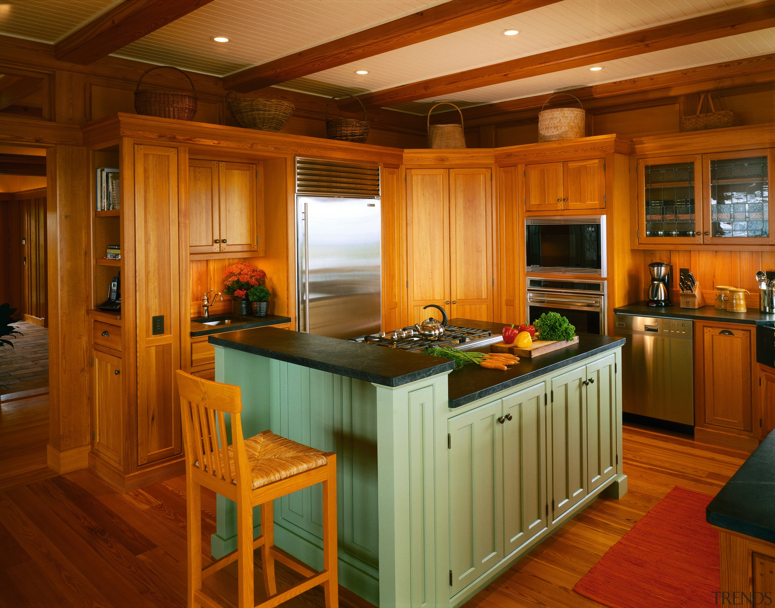 view of this kitchen featuring timber flooring, painted cabinetry, countertop, cuisine classique, flooring, hardwood, interior design, kitchen, real estate, room, wood, wood flooring, brown