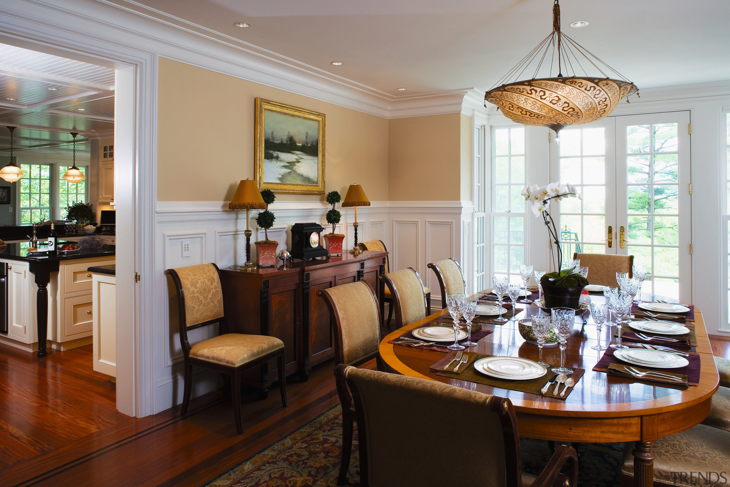view of the dining area featuring mahogany flooring, dining room, home, interior design, living room, real estate, room, table, gray