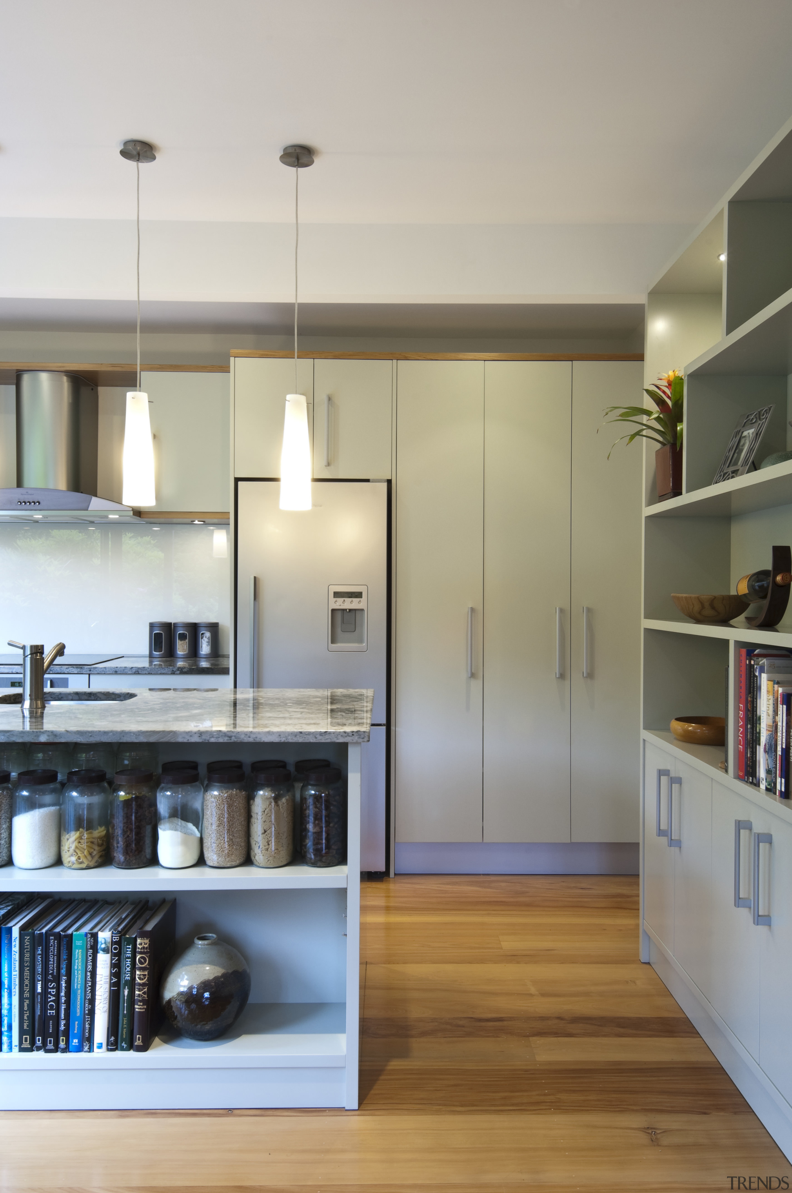 A new layout ensures views take priority.Mood lighting cabinetry, countertop, floor, flooring, hardwood, interior design, kitchen, room, shelf, shelving, wood flooring, gray