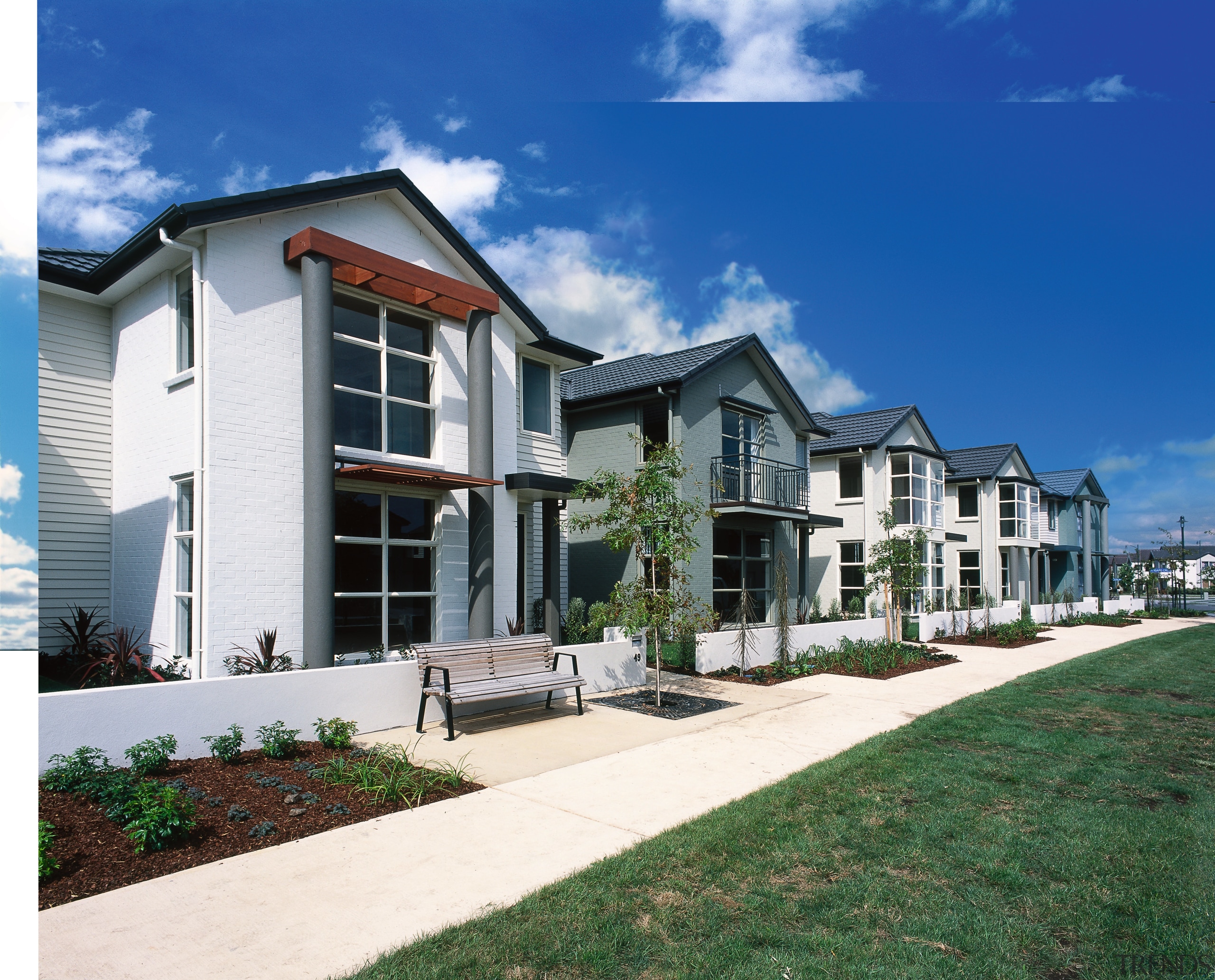 Row of new two-storey homes in residential development, cottage, elevation, estate, facade, home, house, mansion, neighbourhood, property, real estate, residential area, siding, sky, suburb, villa, window, blue