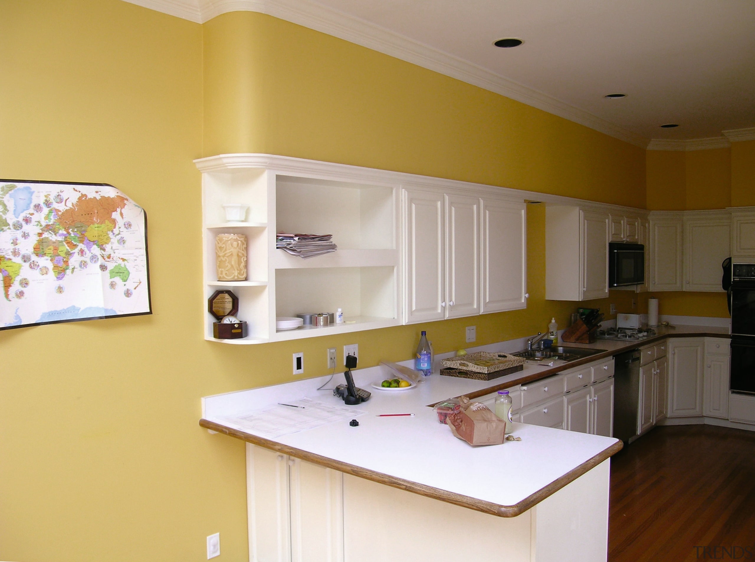 before shots of this narrow kitchen that is cabinetry, countertop, home, interior design, kitchen, real estate, room, orange, brown, gray