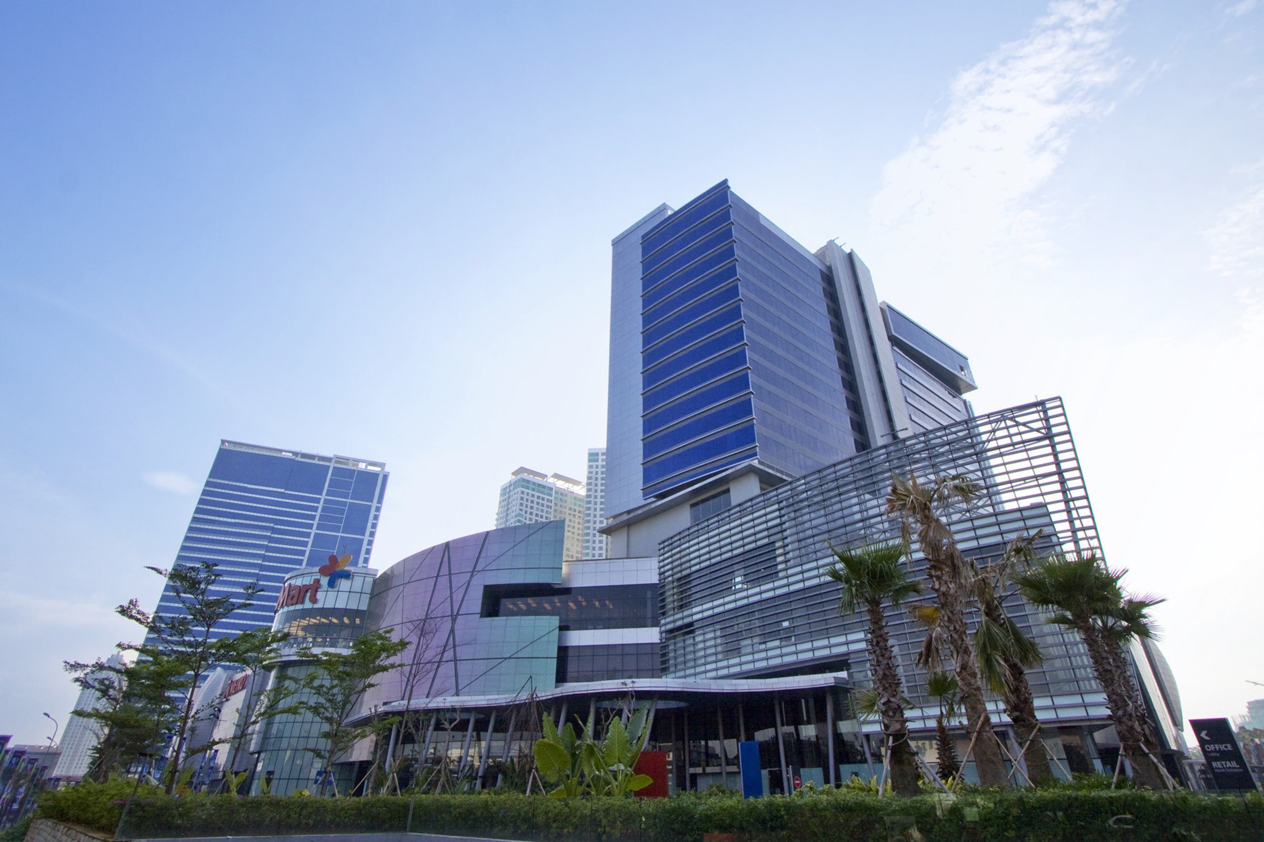 View of towers from exterior. - View of apartment, architecture, building, city, commercial building, condominium, corporate headquarters, daytime, downtown, facade, headquarters, hotel, metropolis, metropolitan area, mixed use, property, real estate, residential area, sky, skyscraper, tower block, urban area, white, teal