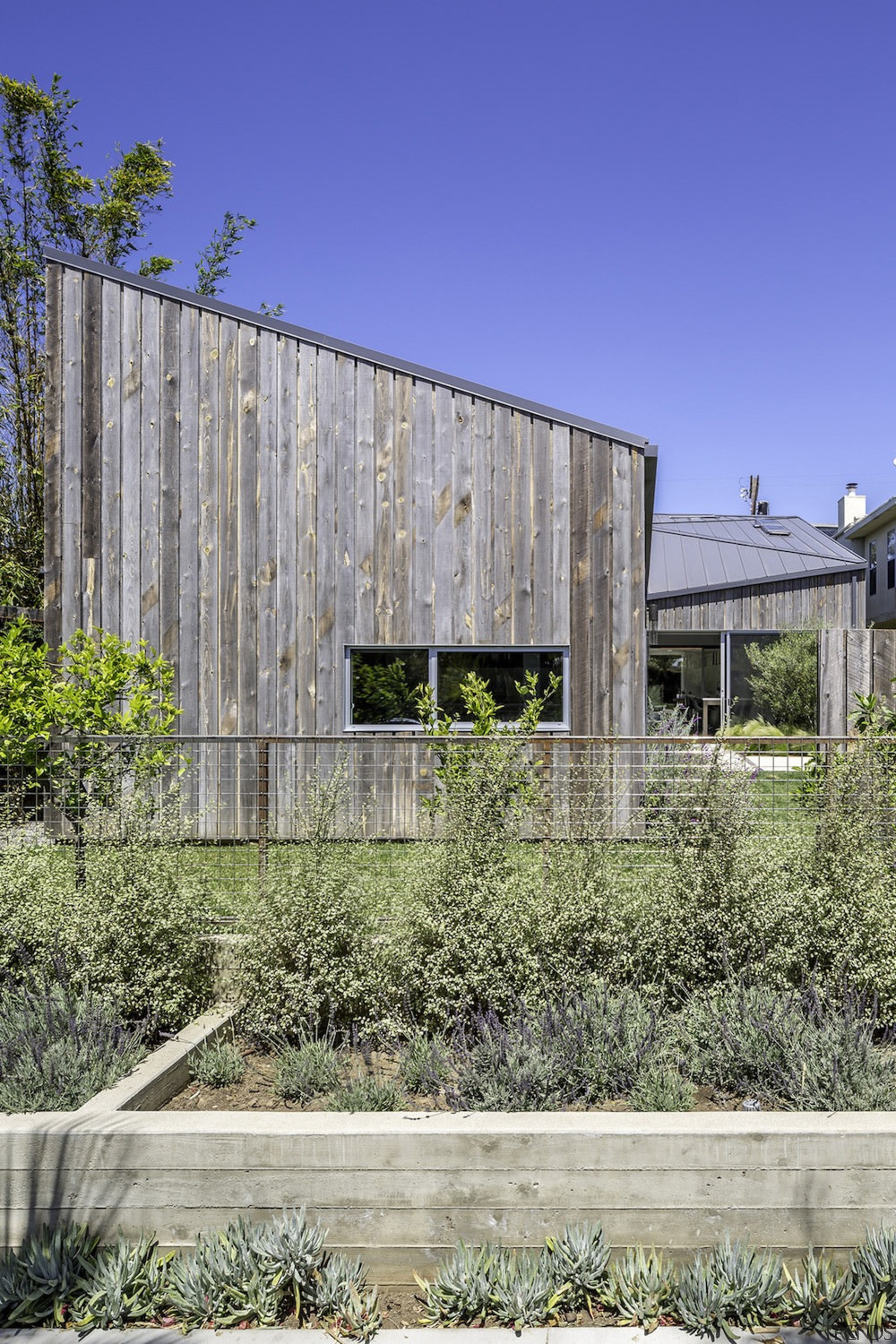 Rustic weatherboards make up the siding on this architecture, building, facade, house, real estate, residential area, gray, blue