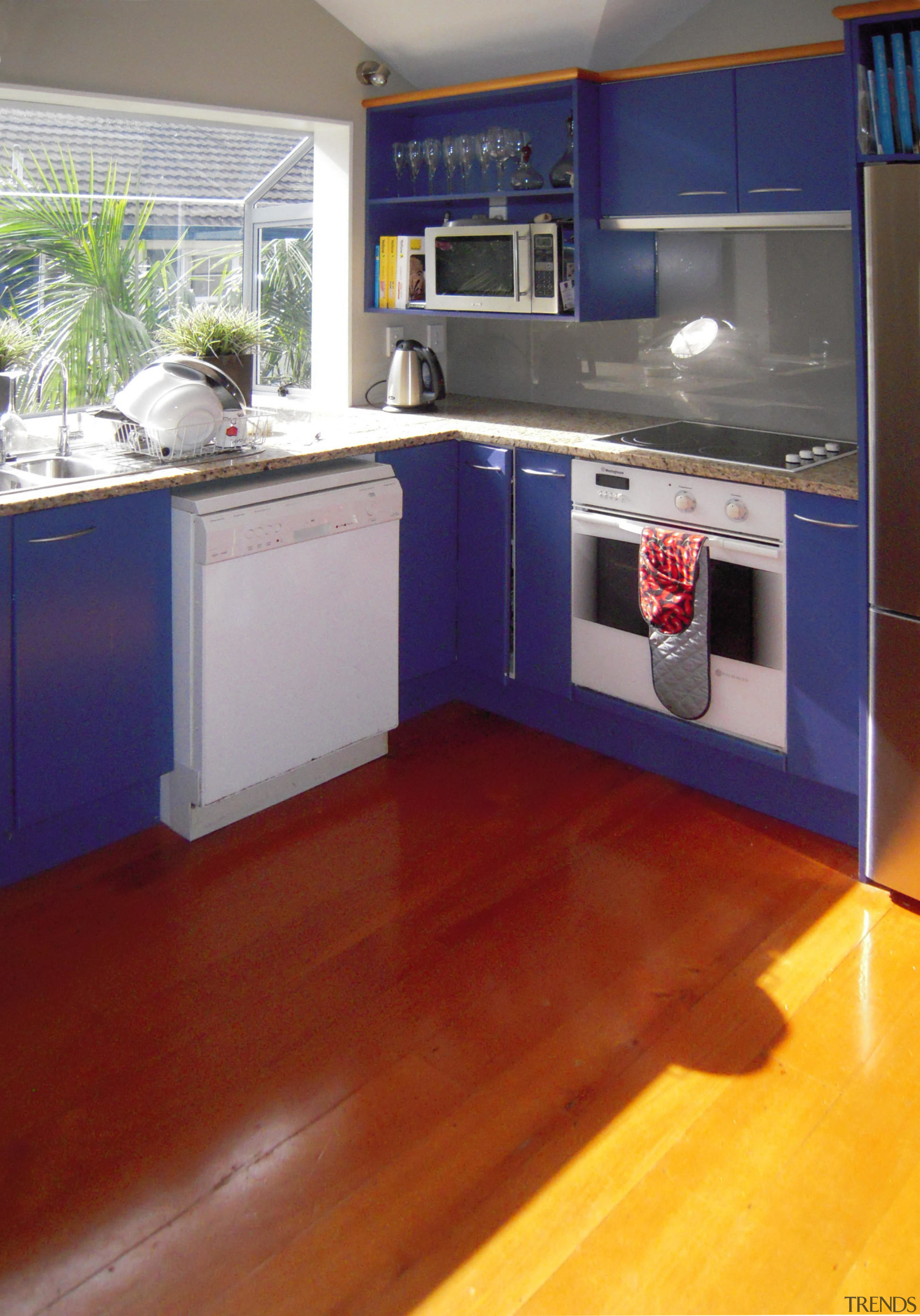 View of the contemporary kitchen - View of countertop, floor, flooring, hardwood, interior design, kitchen, laminate flooring, real estate, room, wood flooring, gray, red