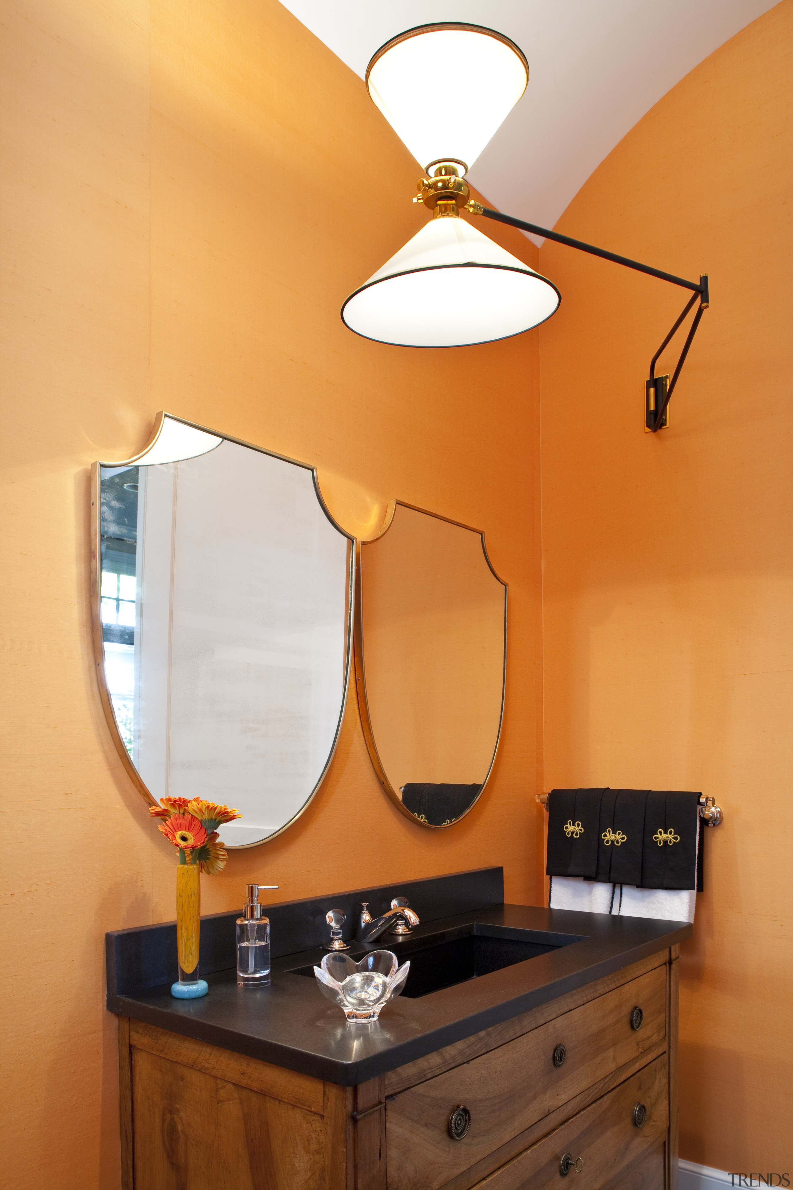 Interior view of this unique bathroom which features ceiling, home, interior design, light fixture, lighting, orange, product design, room, table, wall, orange