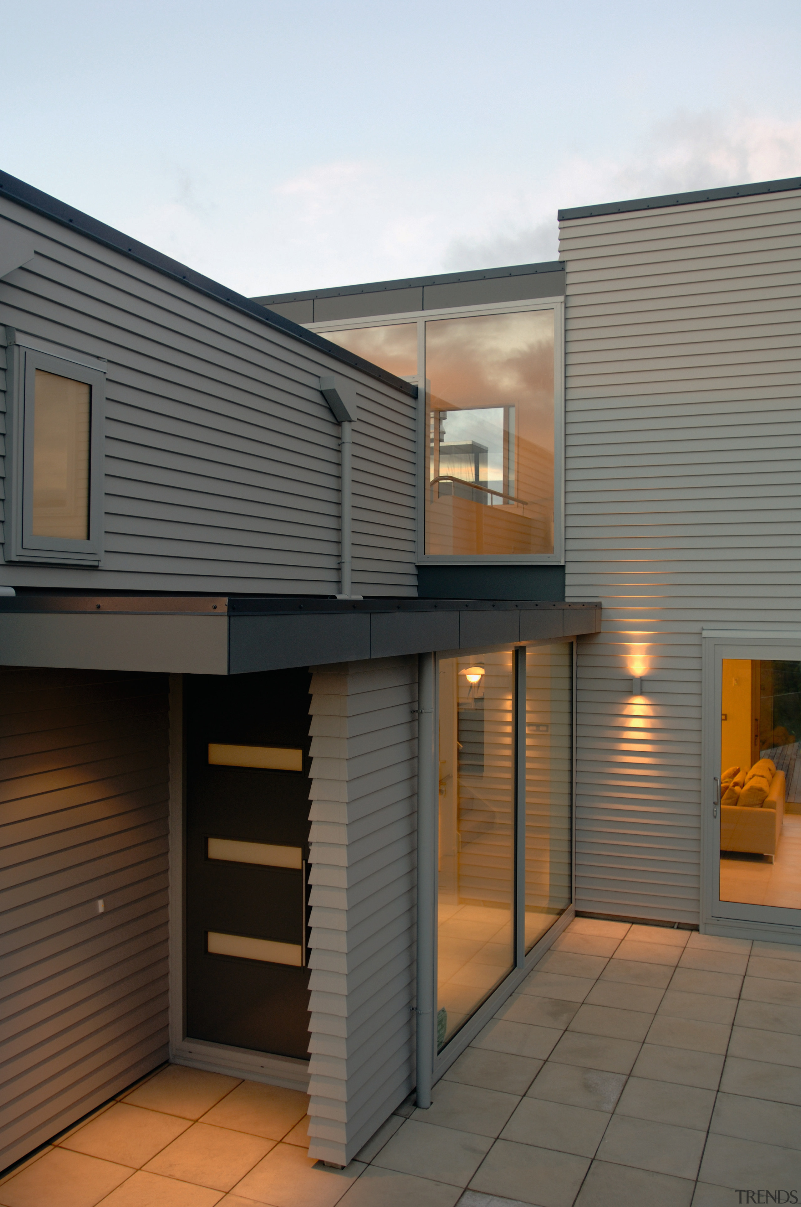 Entranceway of home with weatherboard cladding, large windows architecture, building, daylighting, facade, home, house, real estate, residential area, roof, siding, gray