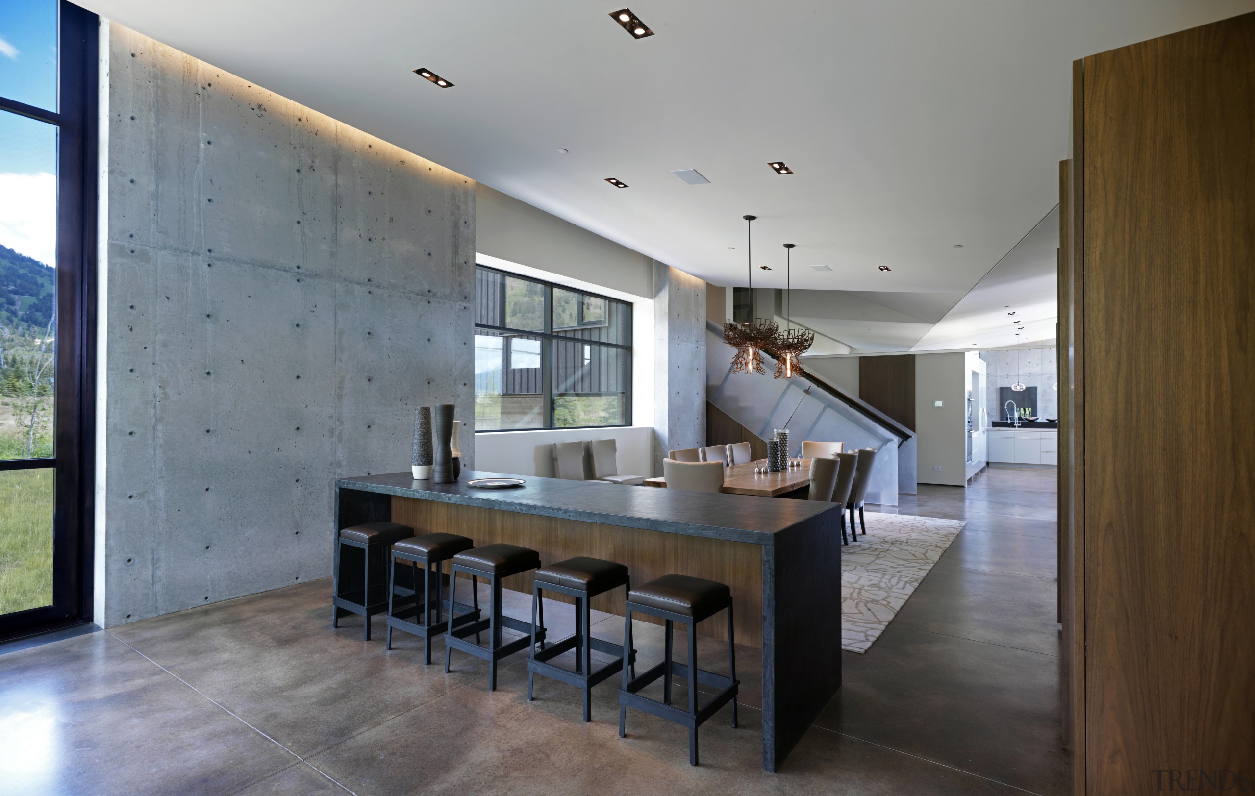 The interior of this mountain home designed by architecture, ceiling, countertop, dining room, estate, floor, flooring, house, interior design, kitchen, real estate, room, table, gray