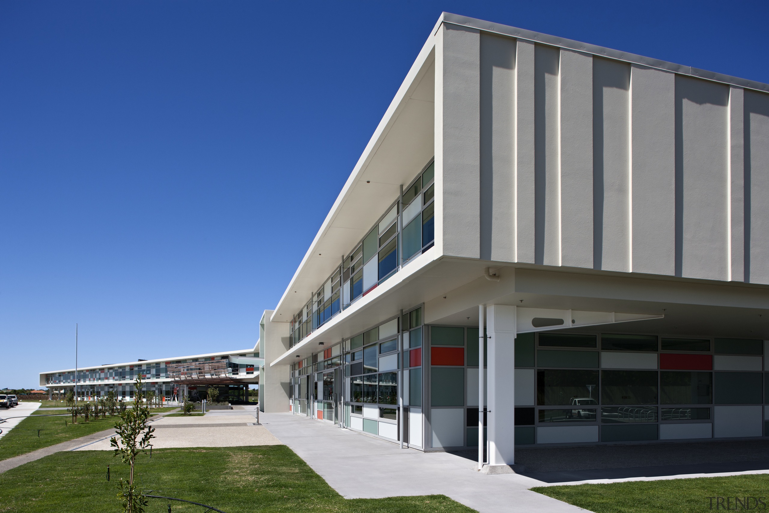 View of exterior of college. - View of apartment, architecture, building, commercial building, condominium, corporate headquarters, daytime, facade, headquarters, metropolitan area, mixed use, real estate, residential area, sky, gray, blue