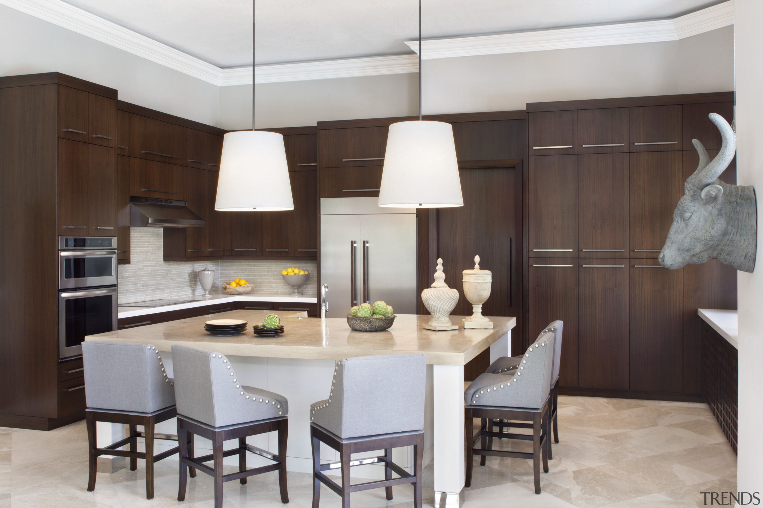 The large island provides ample room for several cabinetry, countertop, cuisine classique, dining room, interior design, kitchen, room, gray