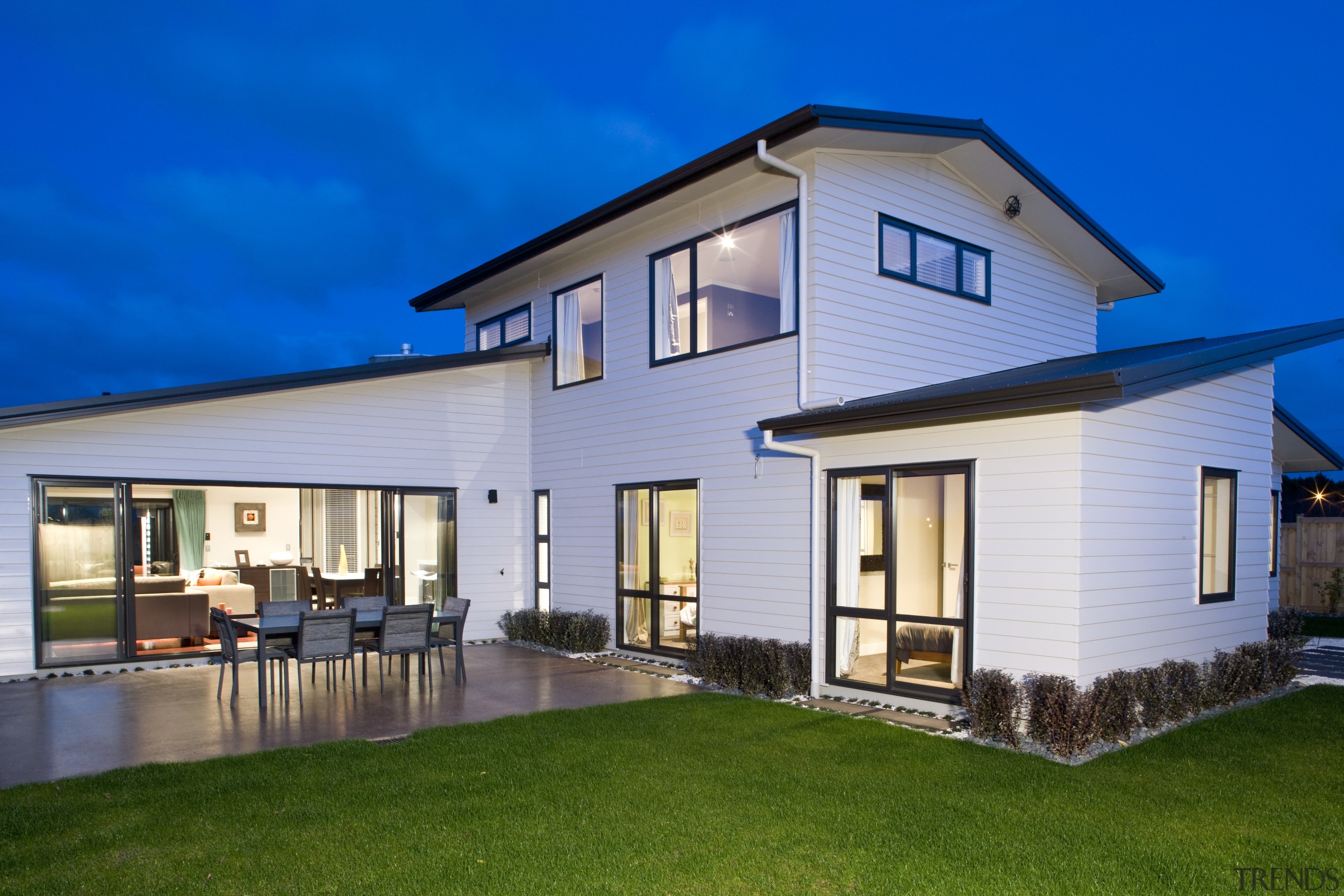 The show home, in Harbourside Drive, Karaka, features cottage, elevation, estate, facade, farmhouse, home, house, property, real estate, residential area, roof, siding, villa, window, blue