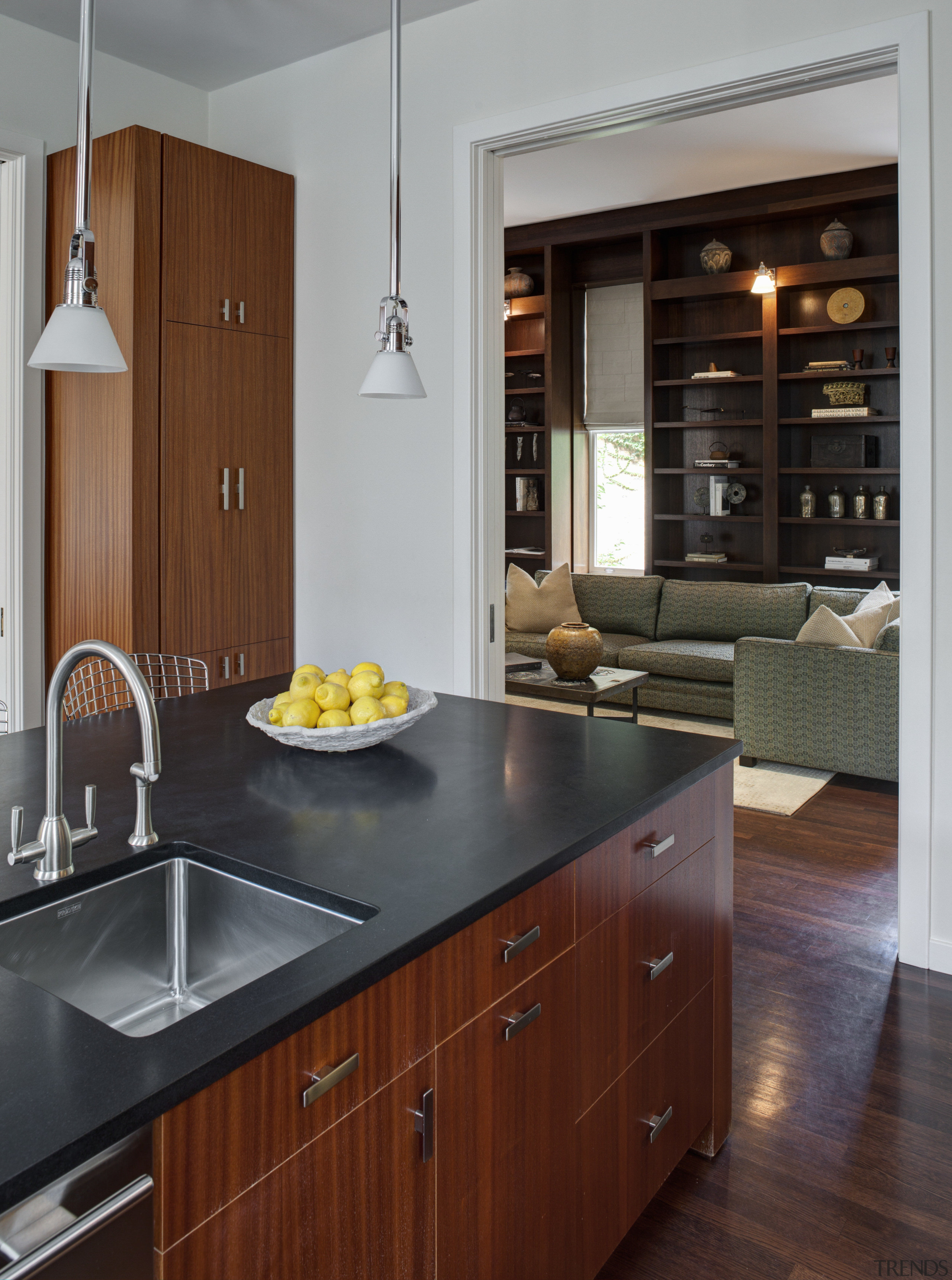 Crisp simplicity defines this contemporary kitchen in an cabinetry, countertop, cuisine classique, floor, flooring, hardwood, home appliance, interior design, kitchen, wood flooring, gray