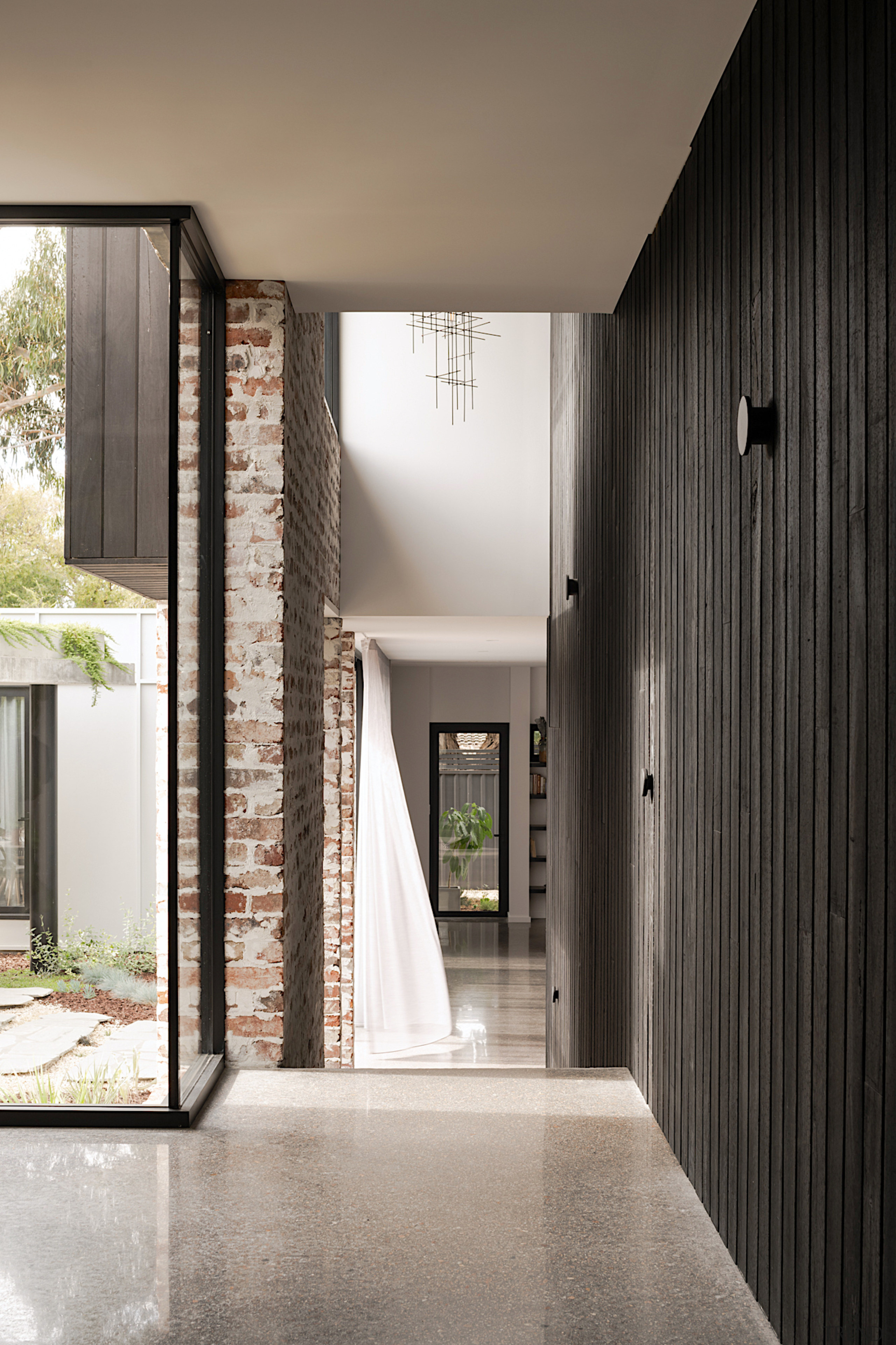 Front door behind, with courtyard ahead to the 