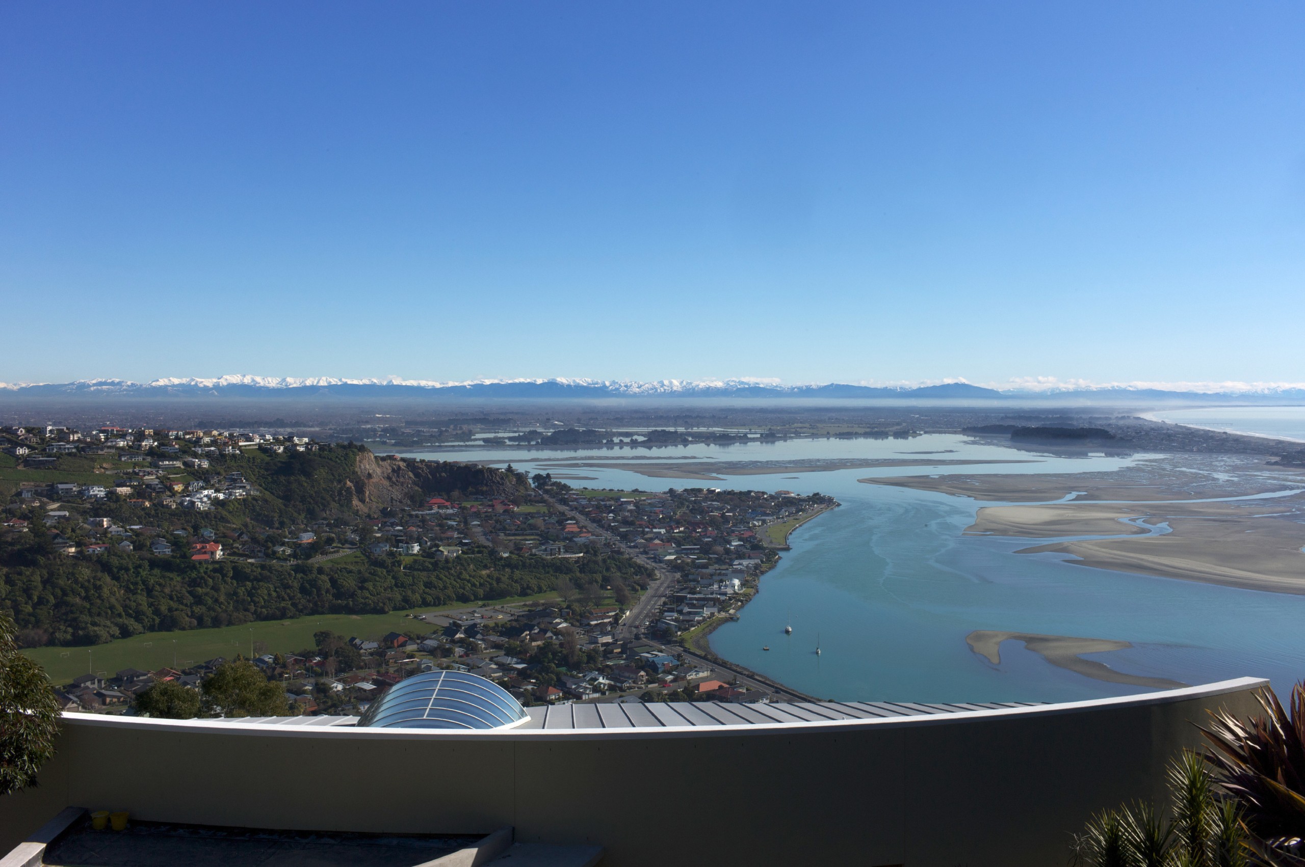 Here is a view of a new innovative aerial photography, atmosphere of earth, bay, bird's eye view, city, coast, coastal and oceanic landforms, horizon, inlet, sea, sky, water, water resources, teal, black