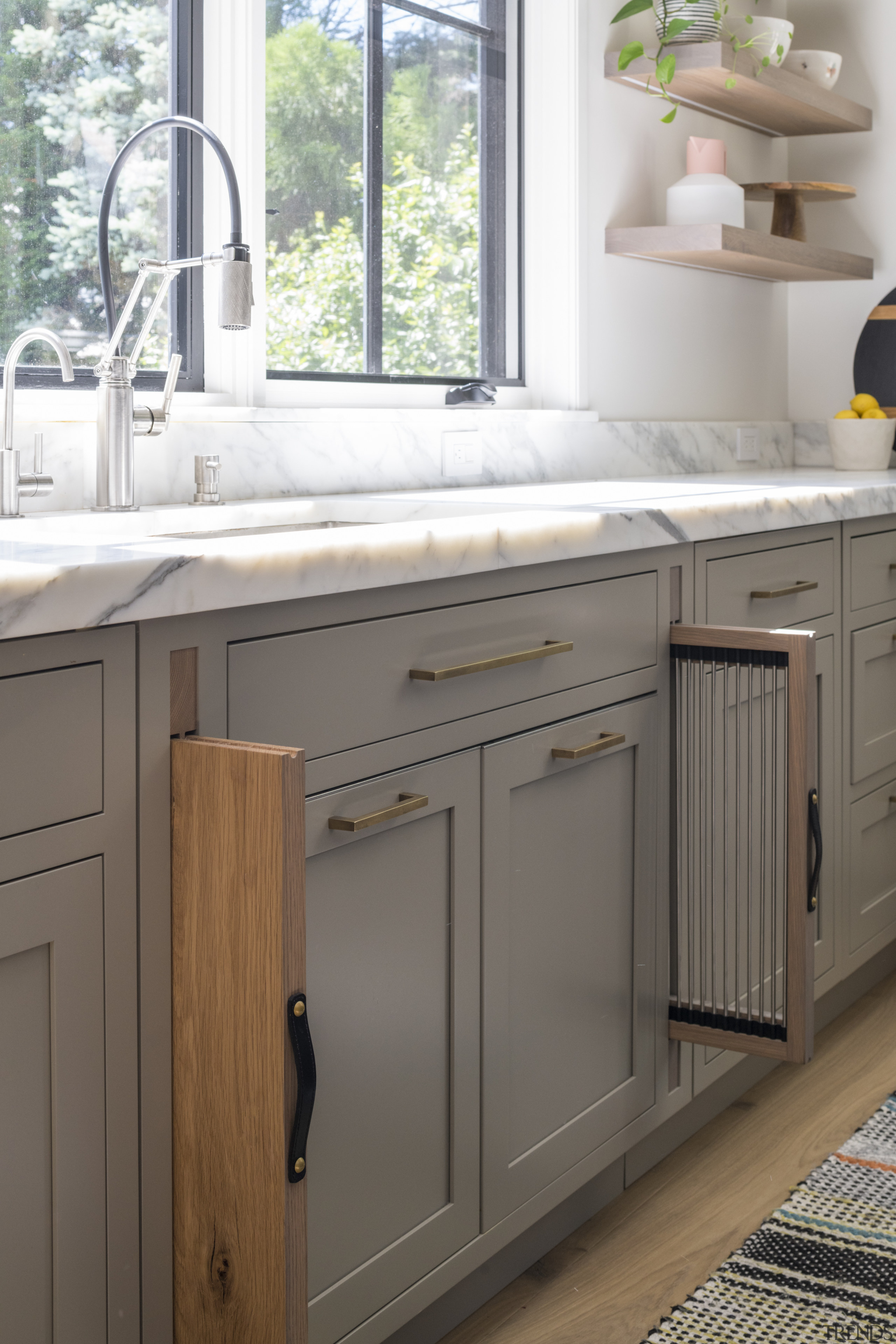 A dish drying rack and chopping board storage 