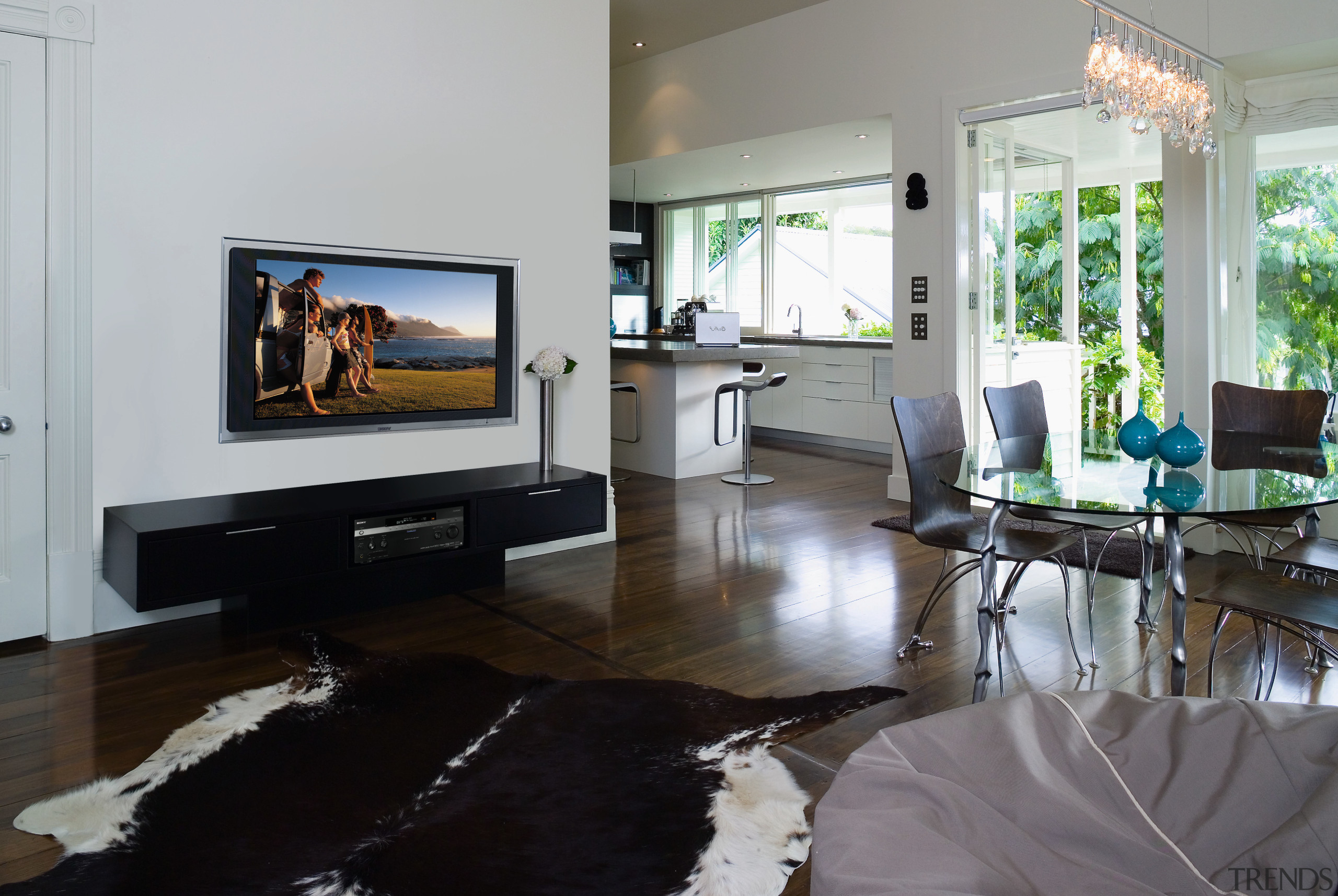 A view of a home theatre system from floor, furniture, interior design, living room, room, table, gray, black