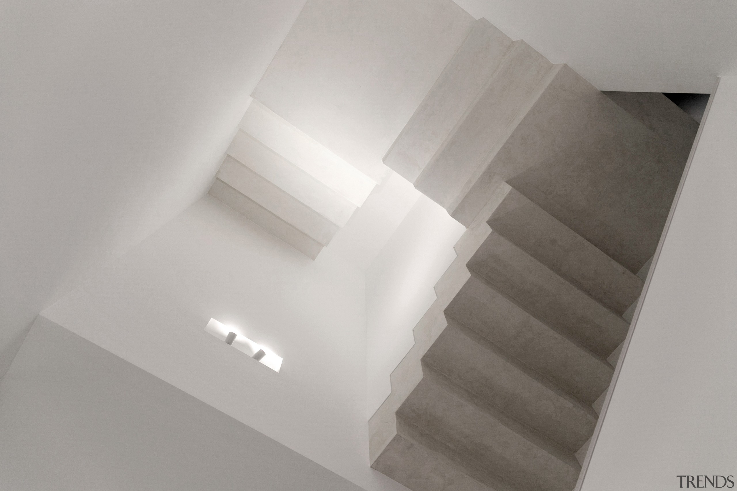 A polished concrete finish creates a serene, sculptural 