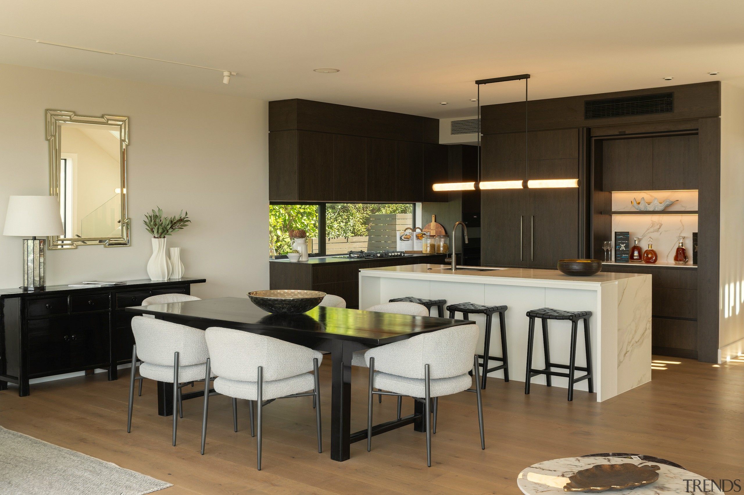 The kitchen connects seamlessly to the lounge, fireplace 