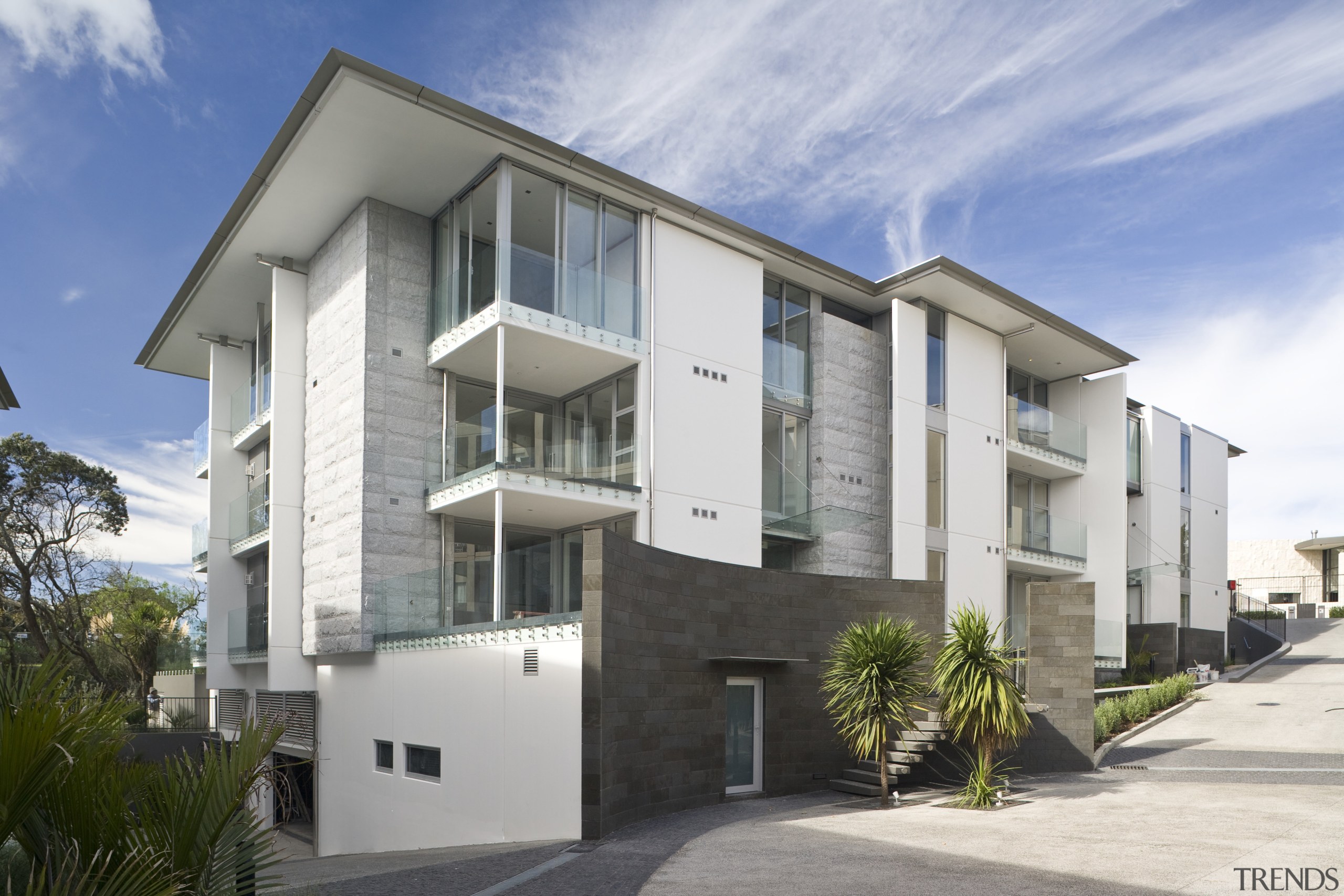 Exterior view of a Parnell apartment complex which apartment, architecture, building, condominium, elevation, facade, home, house, neighbourhood, property, real estate, residential area, gray