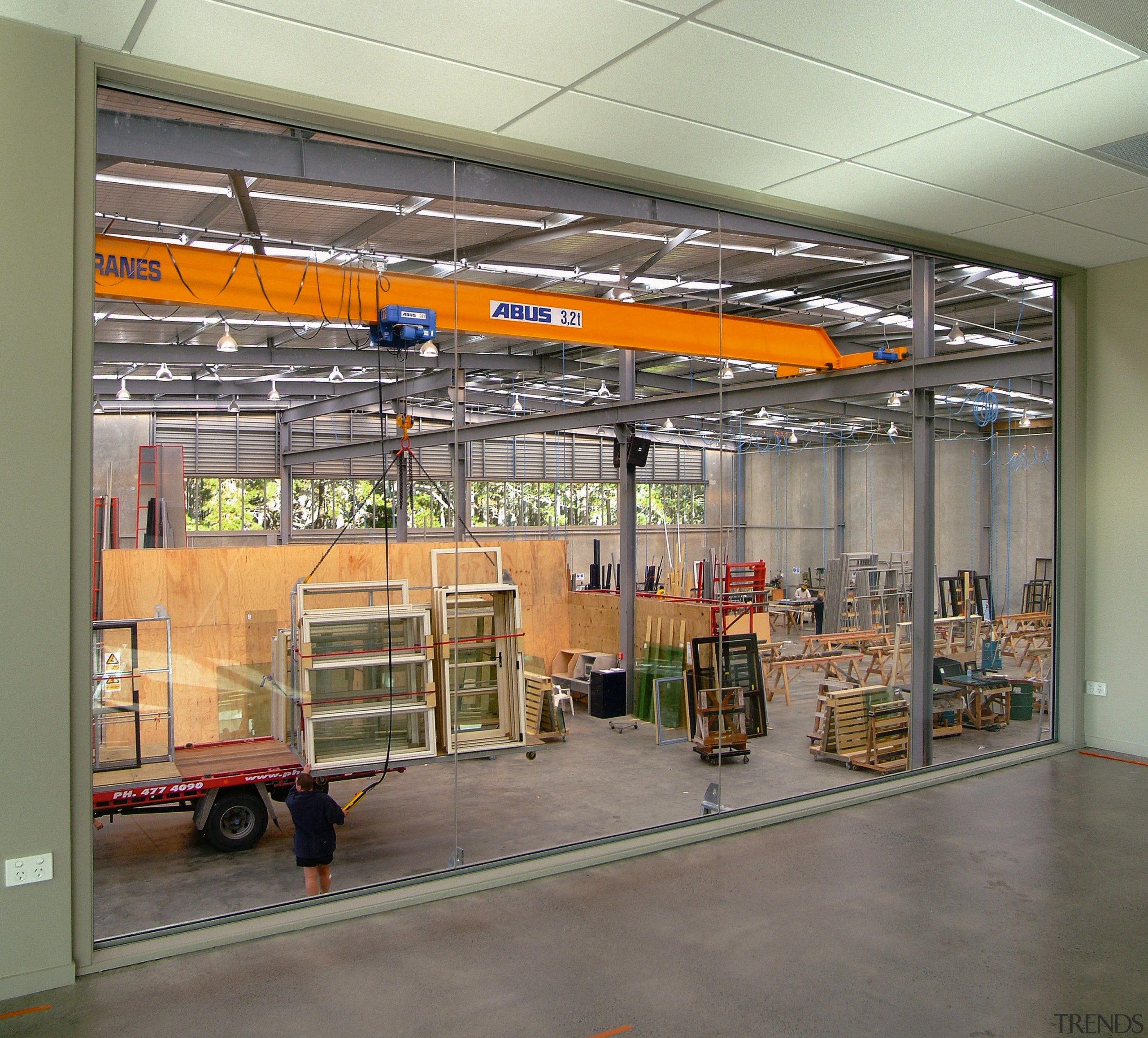 Interior view of aluminium warehouse, showing equipment and ceiling, warehouse, gray, brown