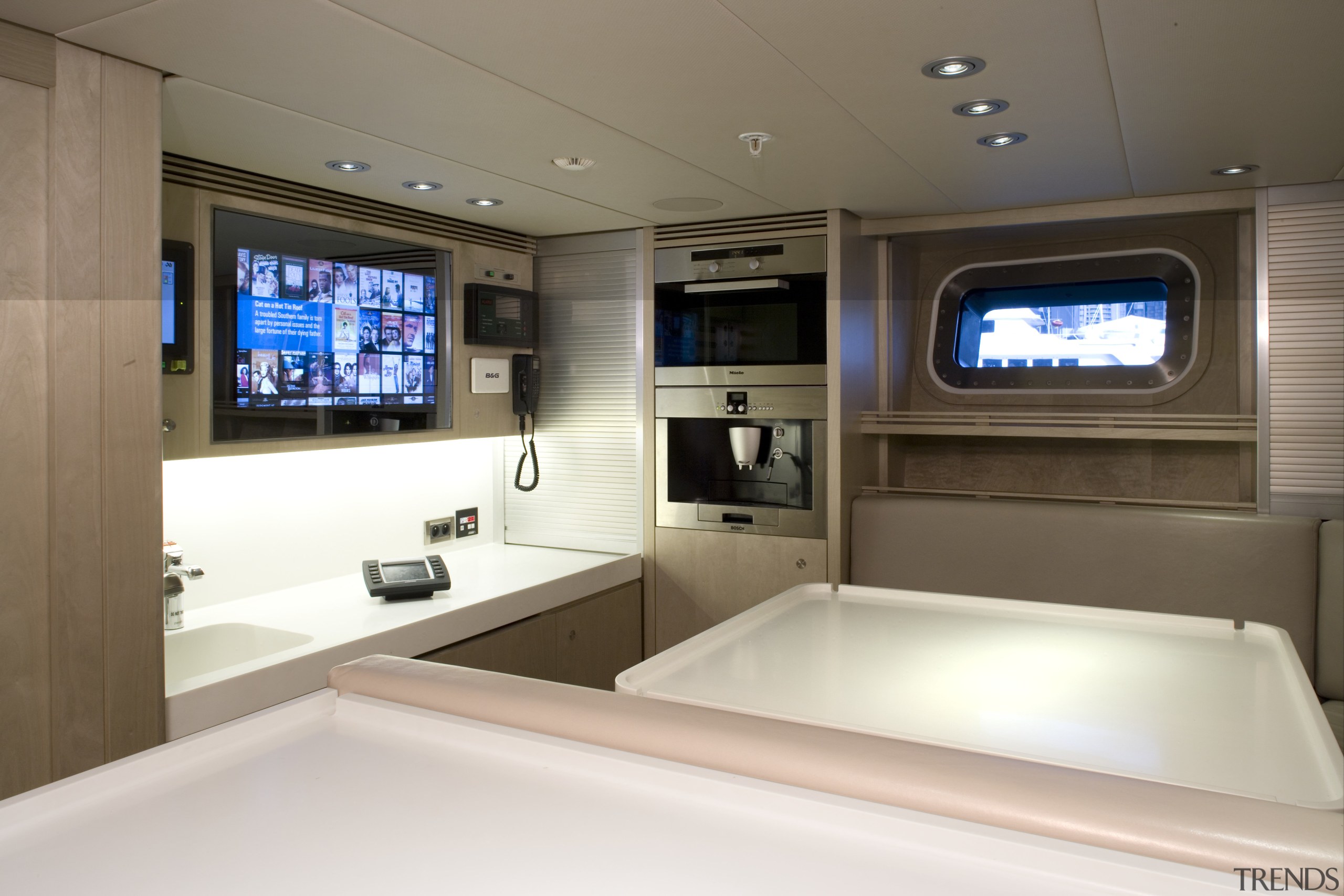 The crew mess is also equipped with a interior design, vehicle, yacht, brown, white