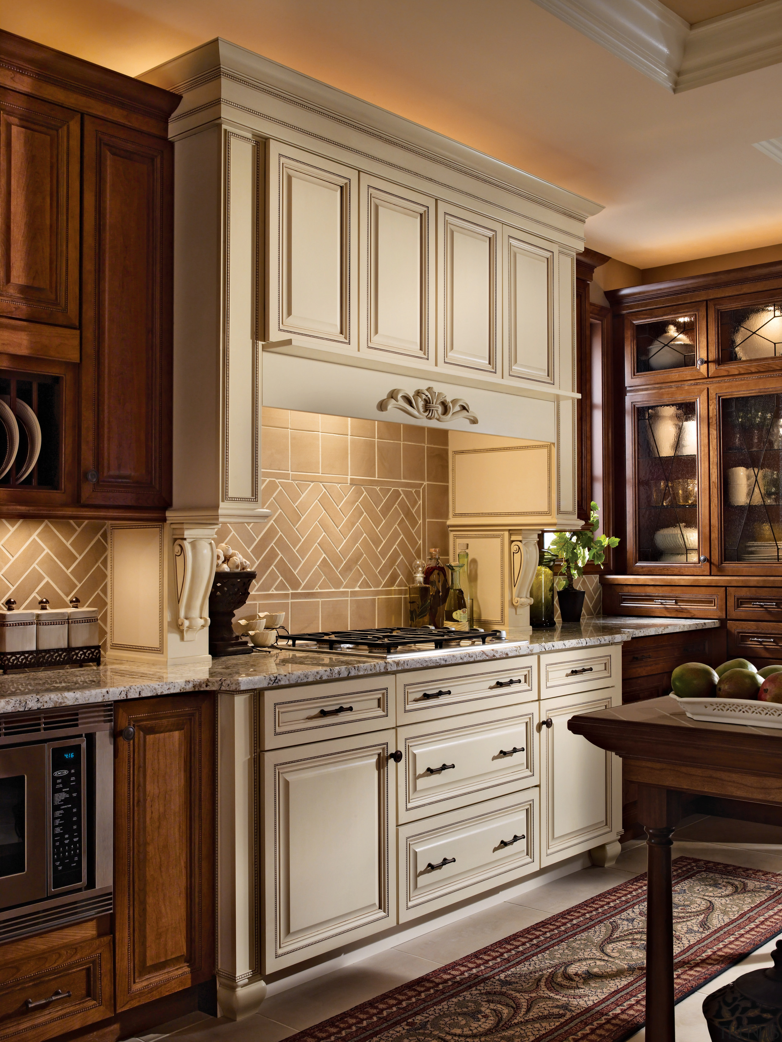 View of a kitchen which features cabinetry available cabinetry, countertop, cuisine classique, furniture, interior design, kitchen, room, under cabinet lighting, brown, orange