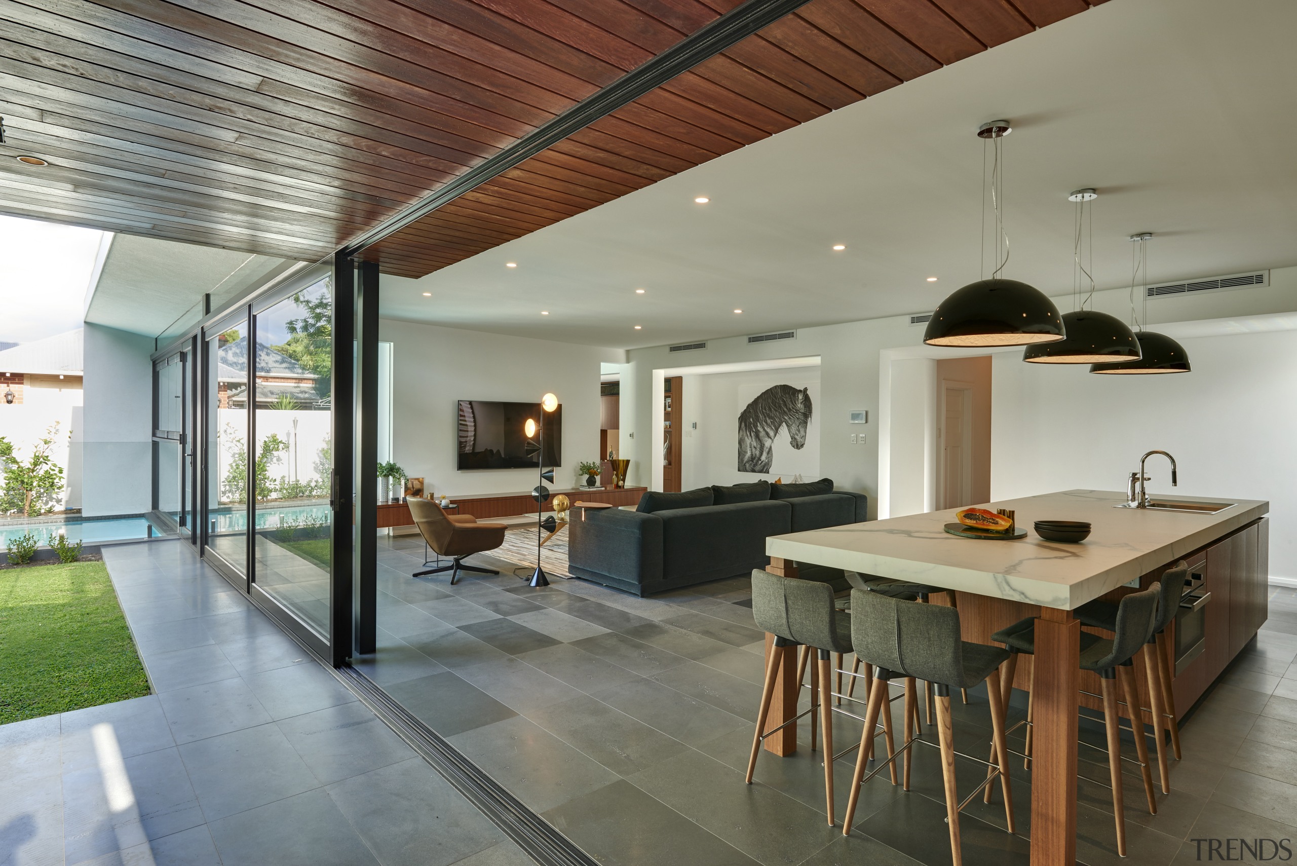 This kitchens wood veneer cabinetry connects with the ceiling, house, interior design, real estate, gray
