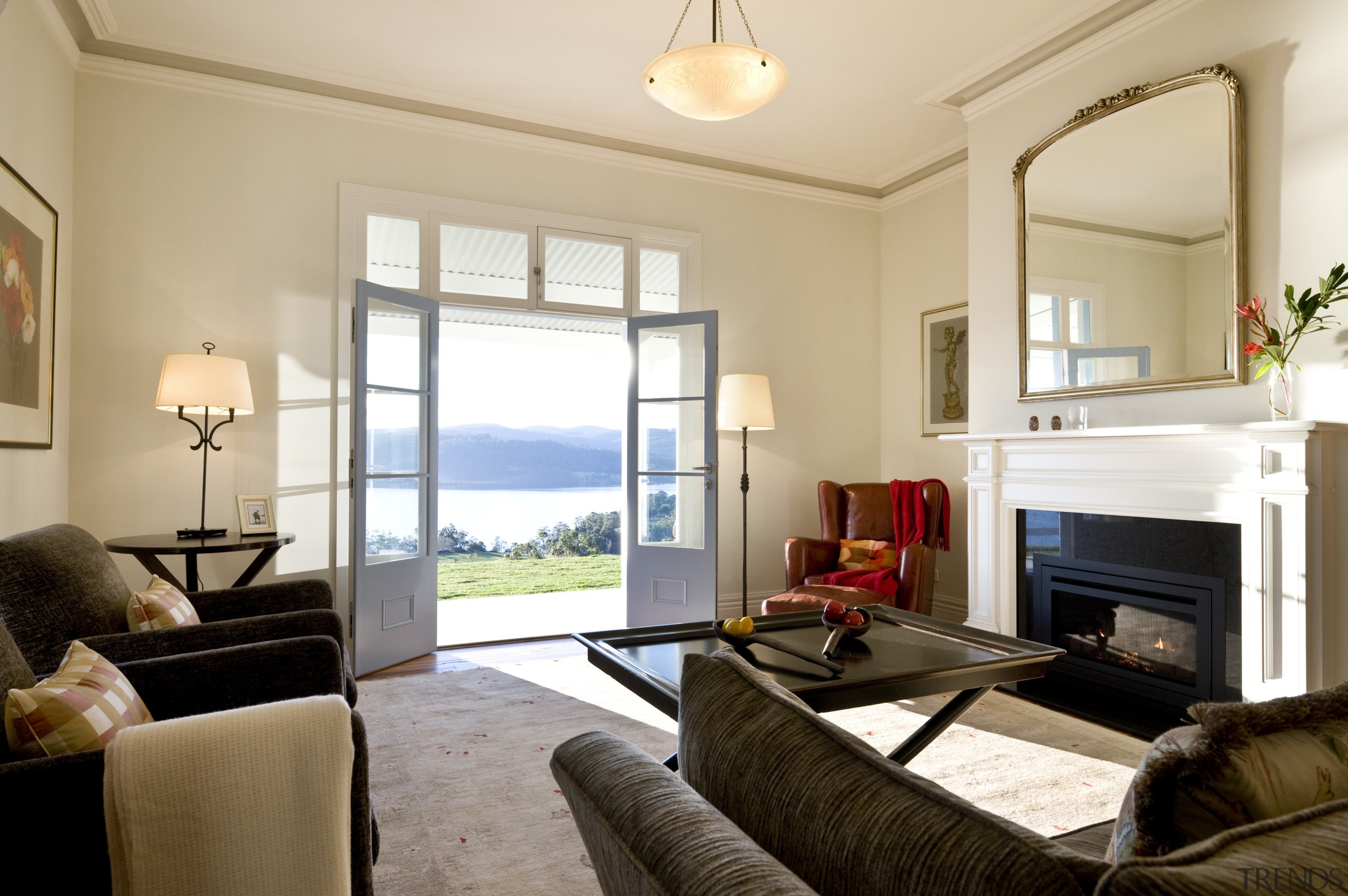 View of living area with fireplace, rug, lighting, bedroom, ceiling, estate, home, interior design, living room, property, real estate, room, suite, window, white