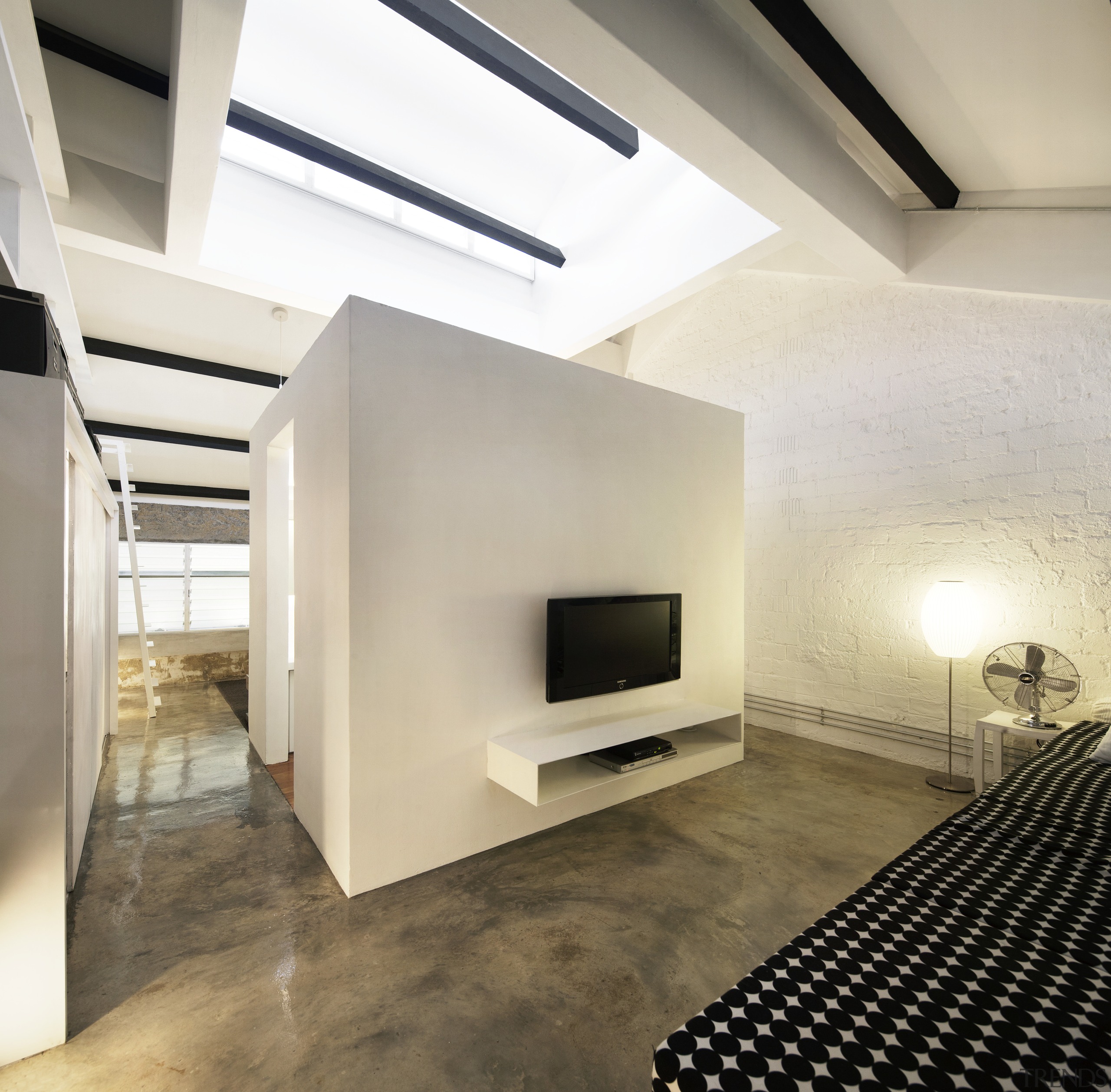 This bathroom in an office-apartment conversion has four architecture, ceiling, daylighting, fireplace, floor, flooring, hearth, interior design, living room, loft, wall, white