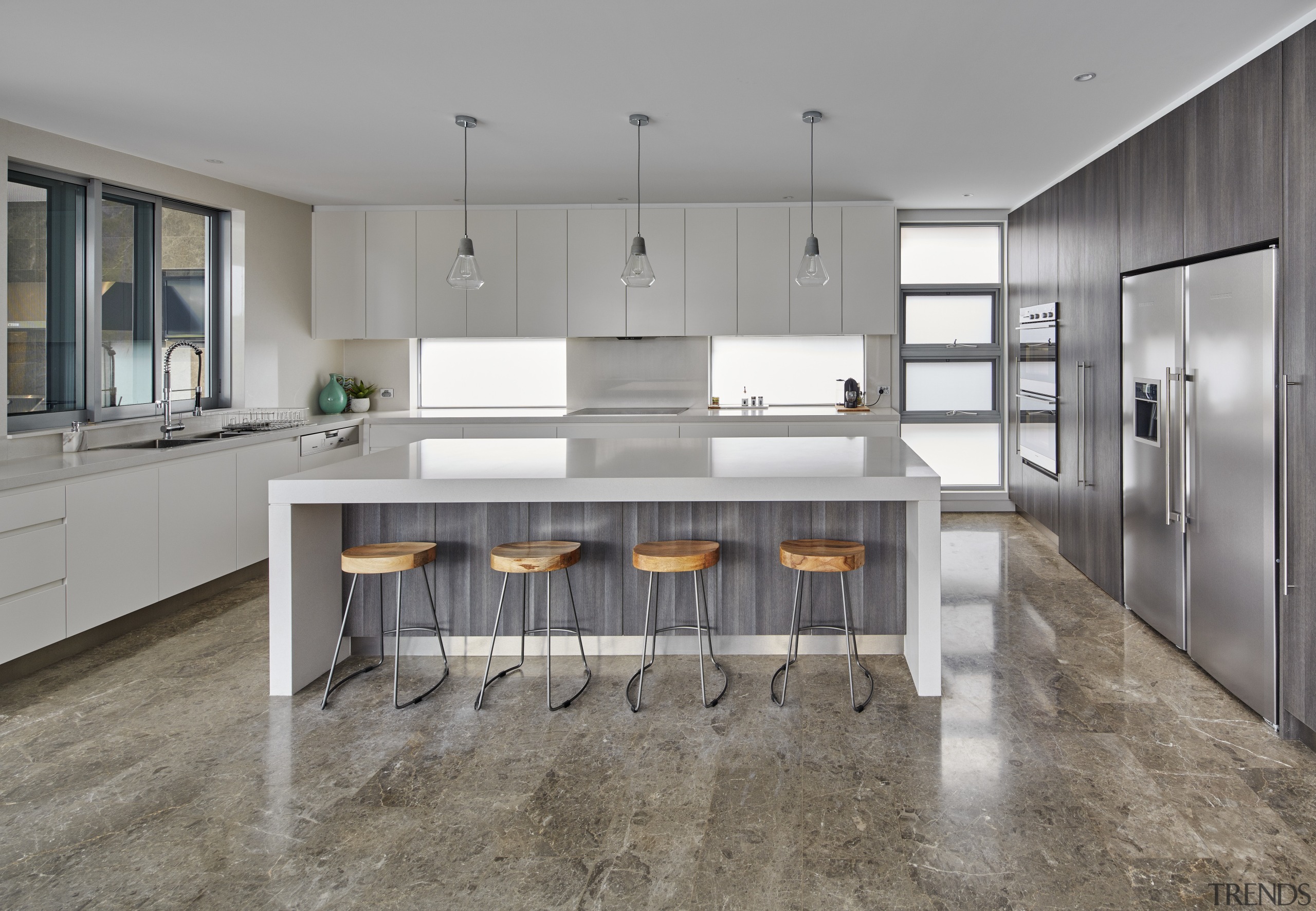 In this house built by Starr Constructions, waterfall-end, cabinetry, countertop, cuisine classique, floor, flooring, interior design, kitchen, room, gray