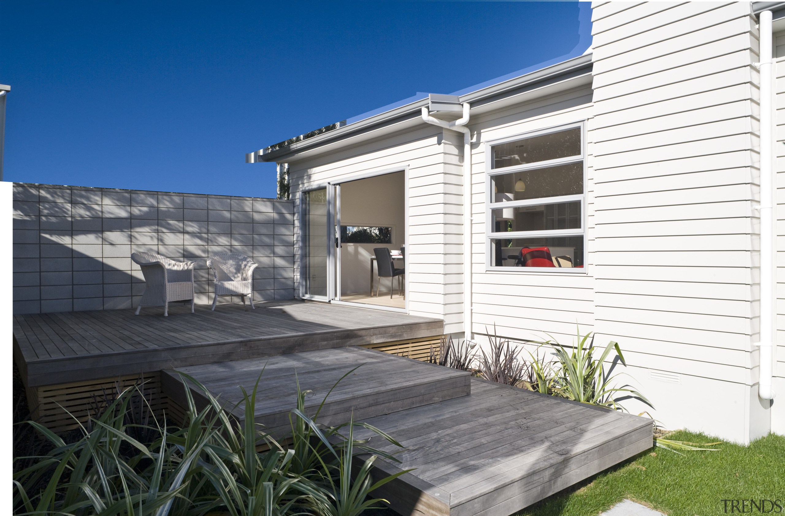 Exterior view of a Harmony Homes show home facade, home, house, property, real estate, residential area, siding, window, white