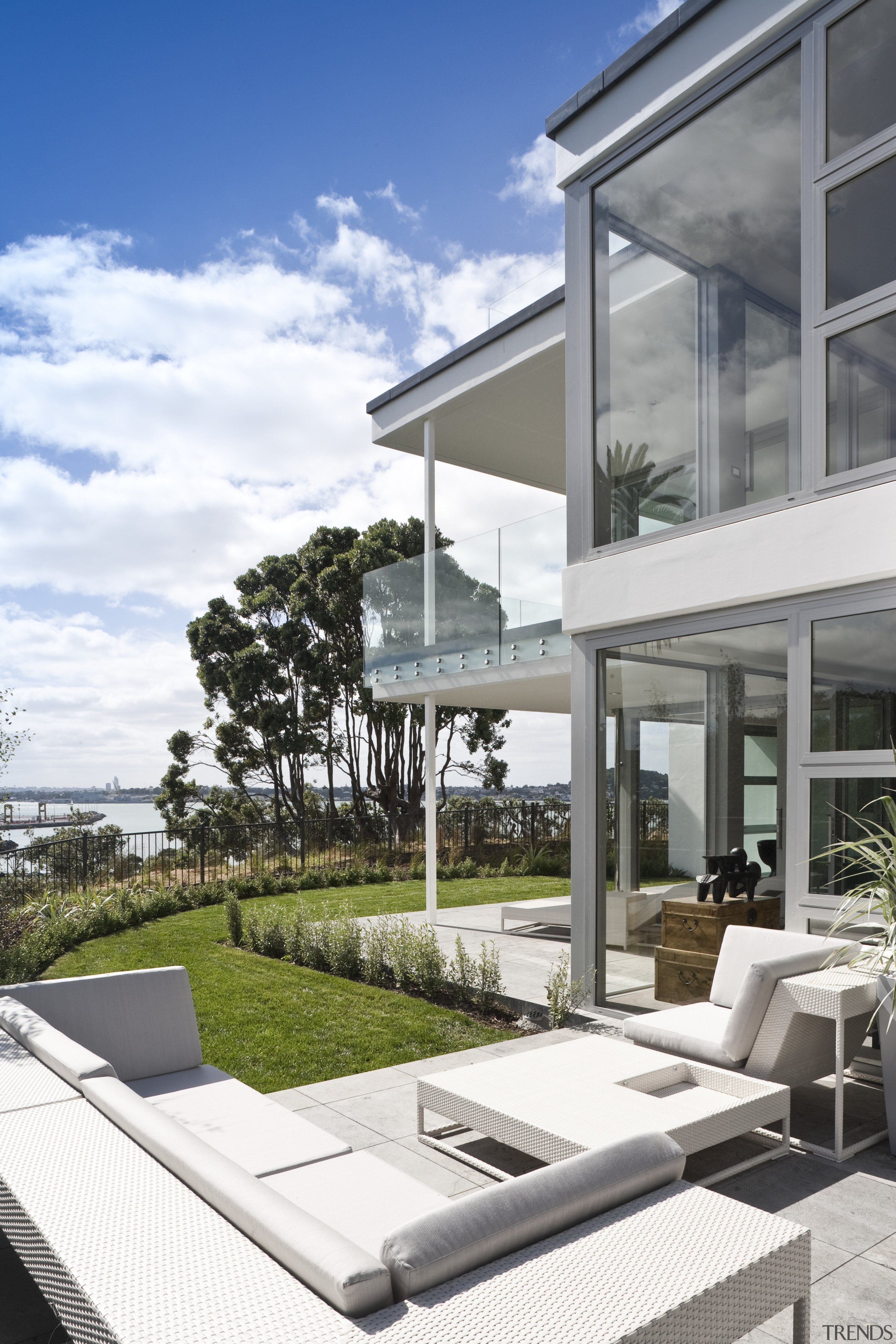 View of a large apartment development in Auckland apartment, architecture, building, condominium, estate, home, house, mixed use, outdoor furniture, property, real estate, residential area, sunlounger, white, gray