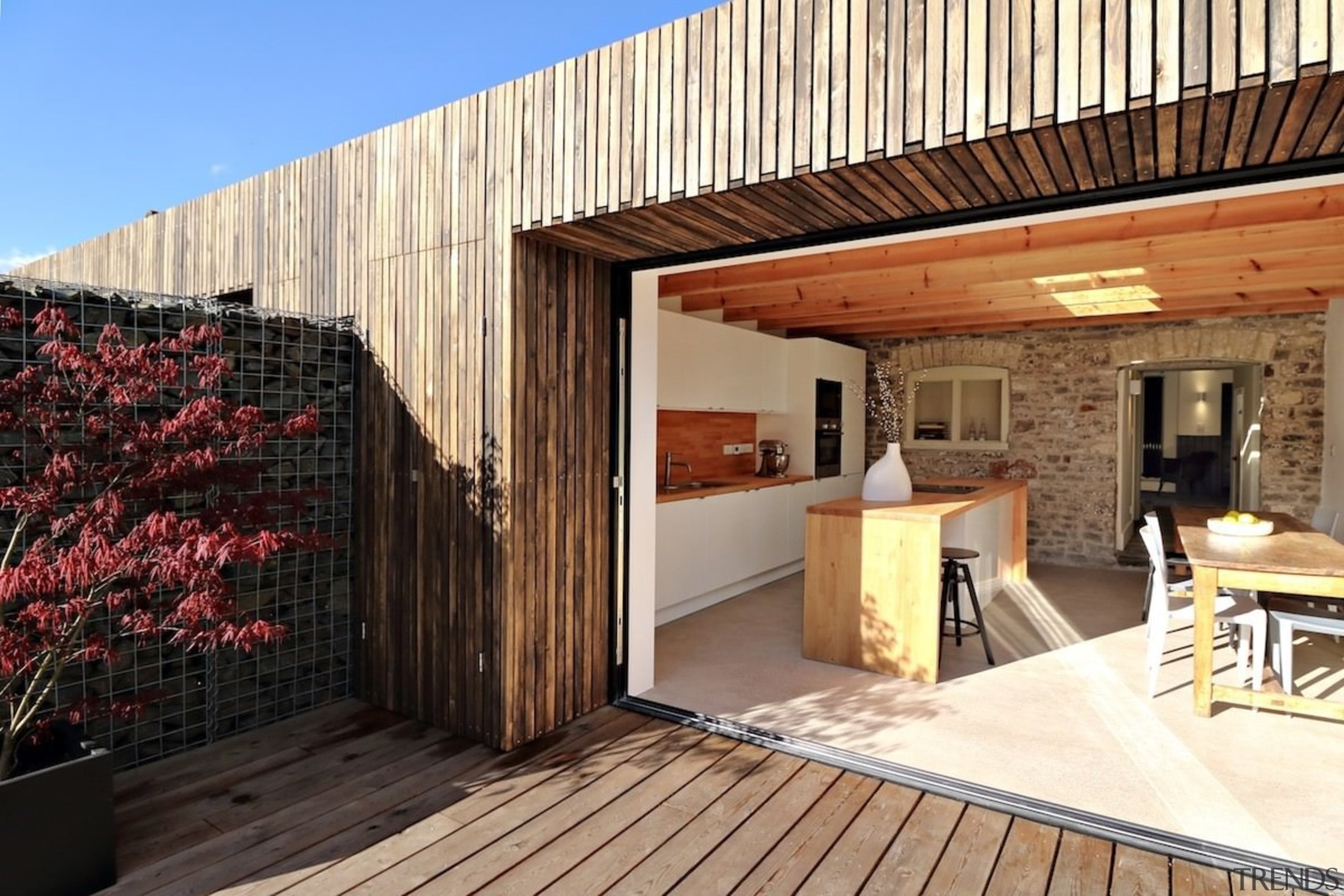 A sheltered outdoor area is perfect for entertaining architecture, facade, home, house, property, real estate, wood, orange, black