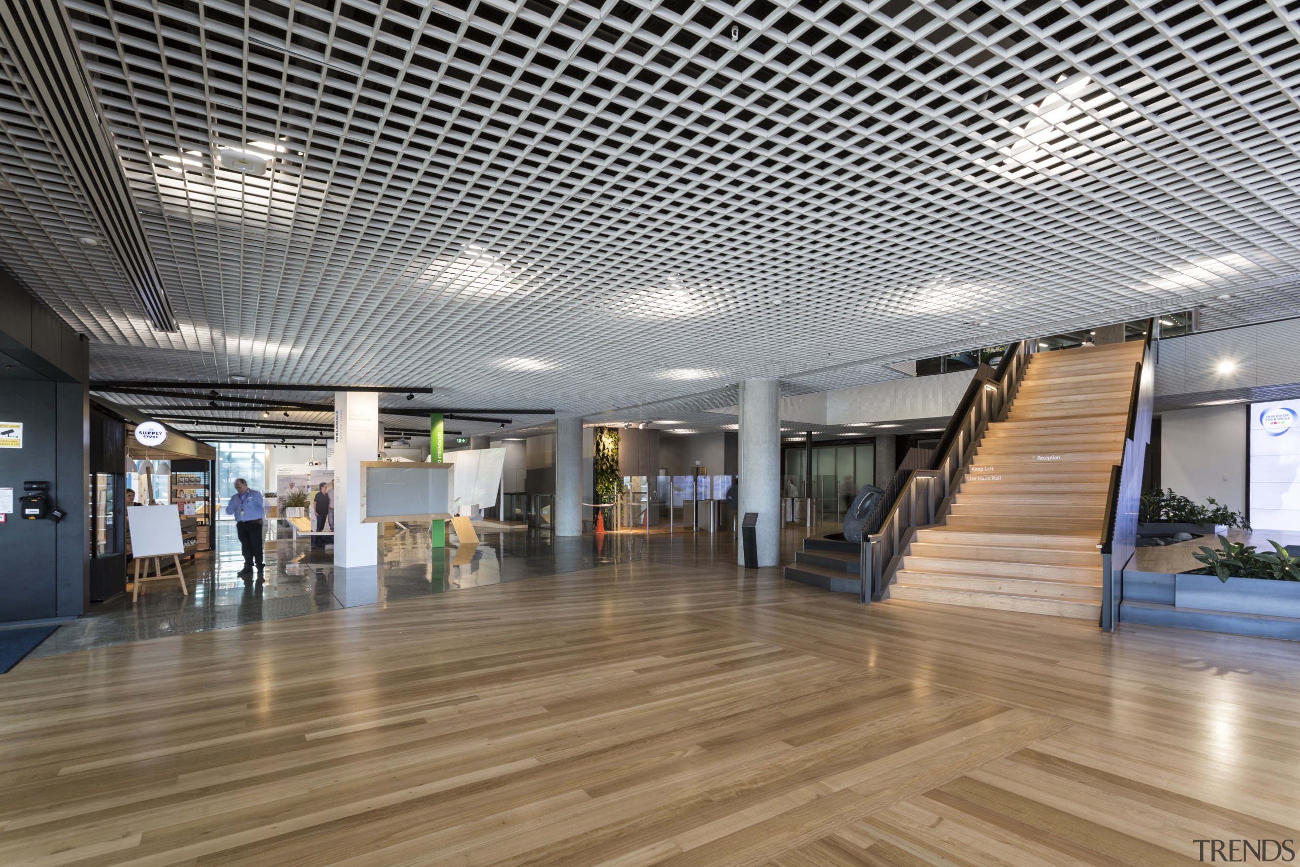 For an industrial touch, the foyer at the architecture, ceiling, daylighting, floor, flooring, interior design, lobby, gray