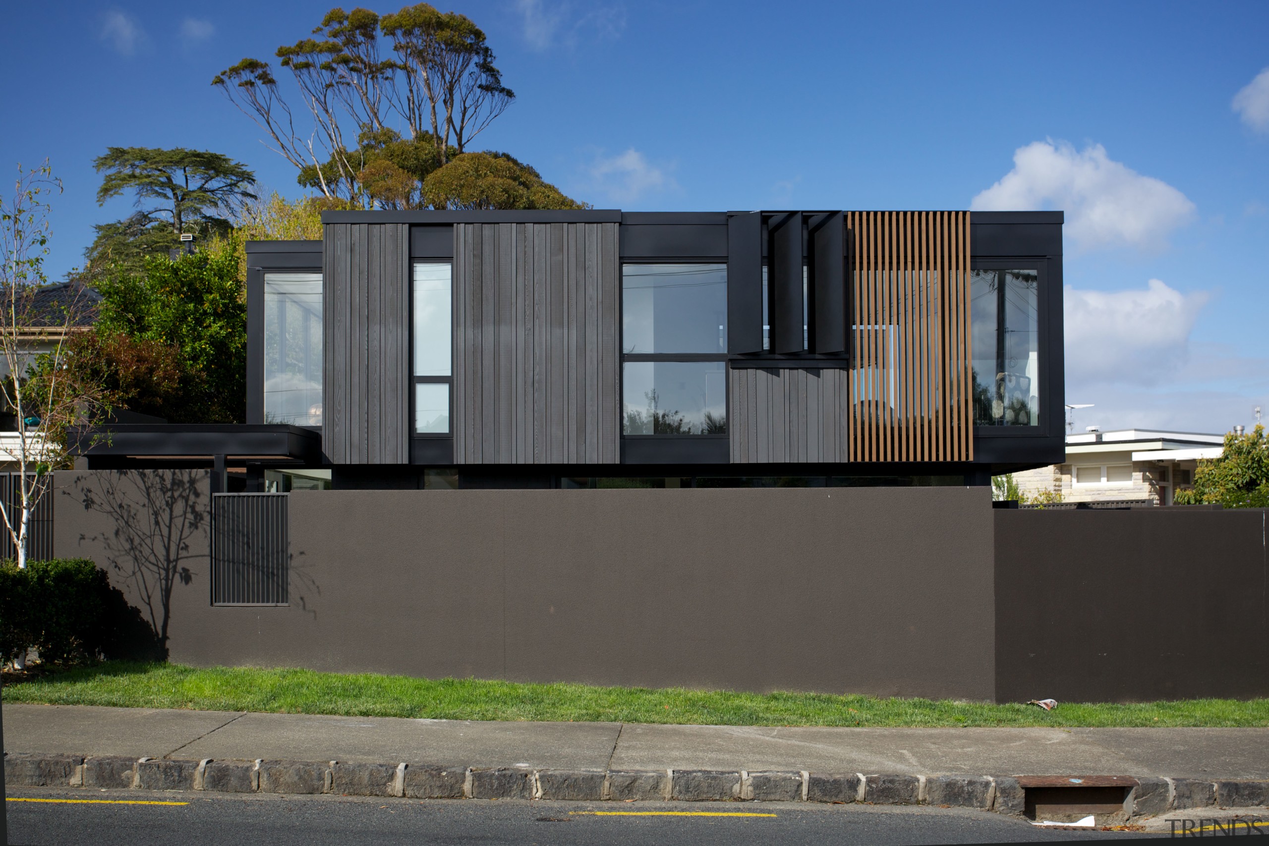 From the street, only this homes articulated upper-cladding architecture, building, condominium, elevation, facade, home, house, neighbourhood, property, real estate, residential area, gray